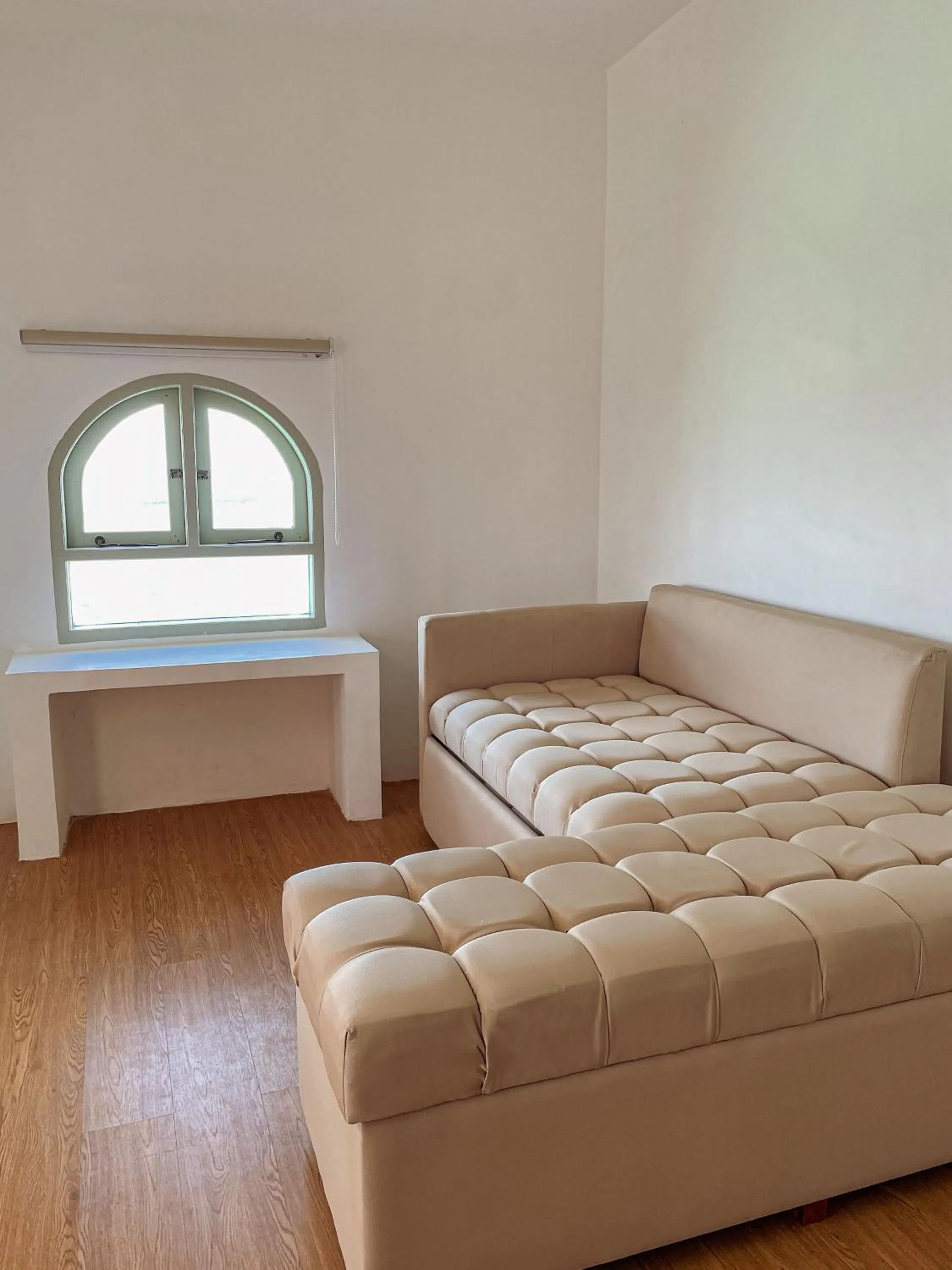 Seating area, Bed in Renjana Beach House