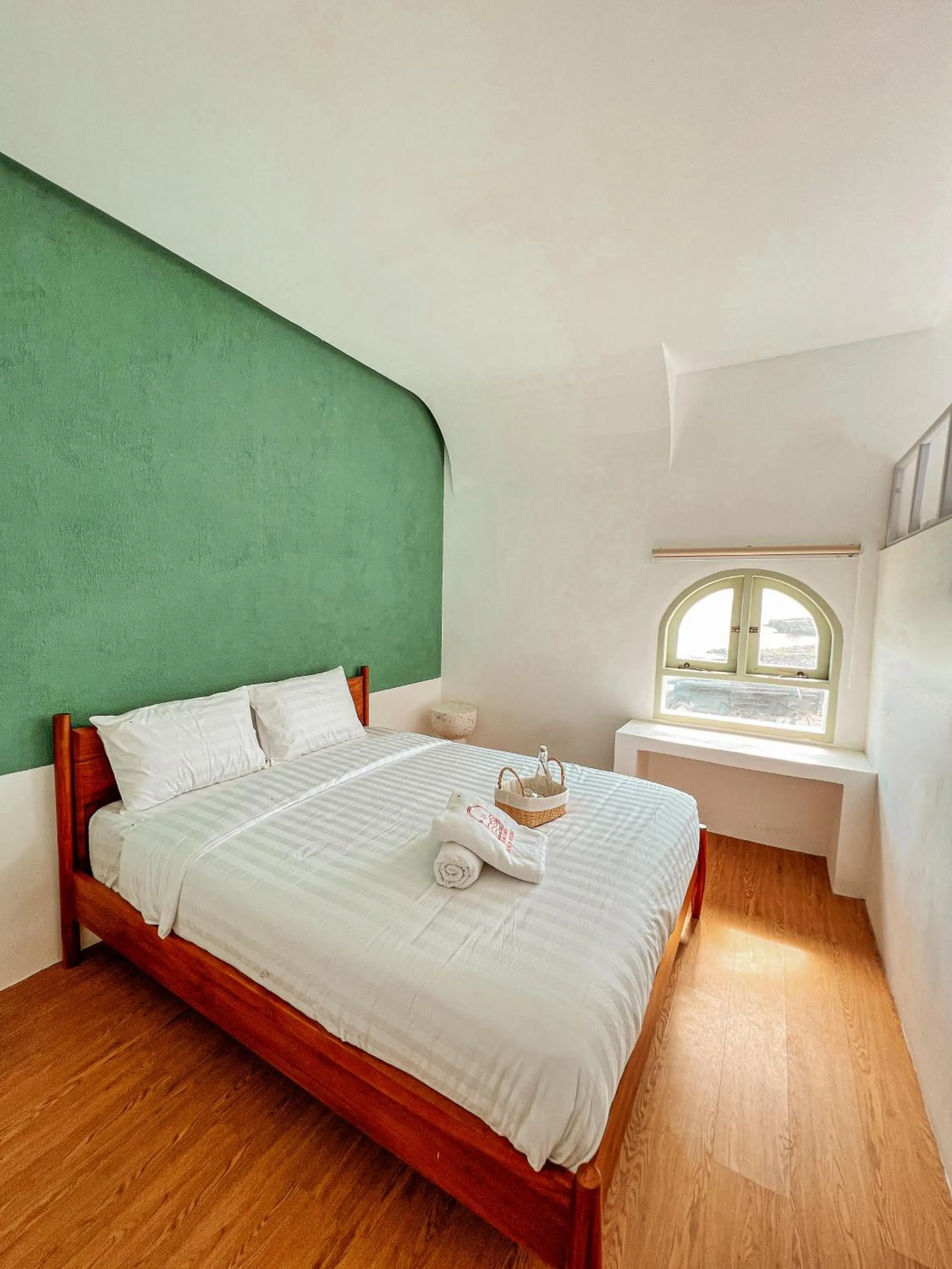 Bed in Renjana Beach House