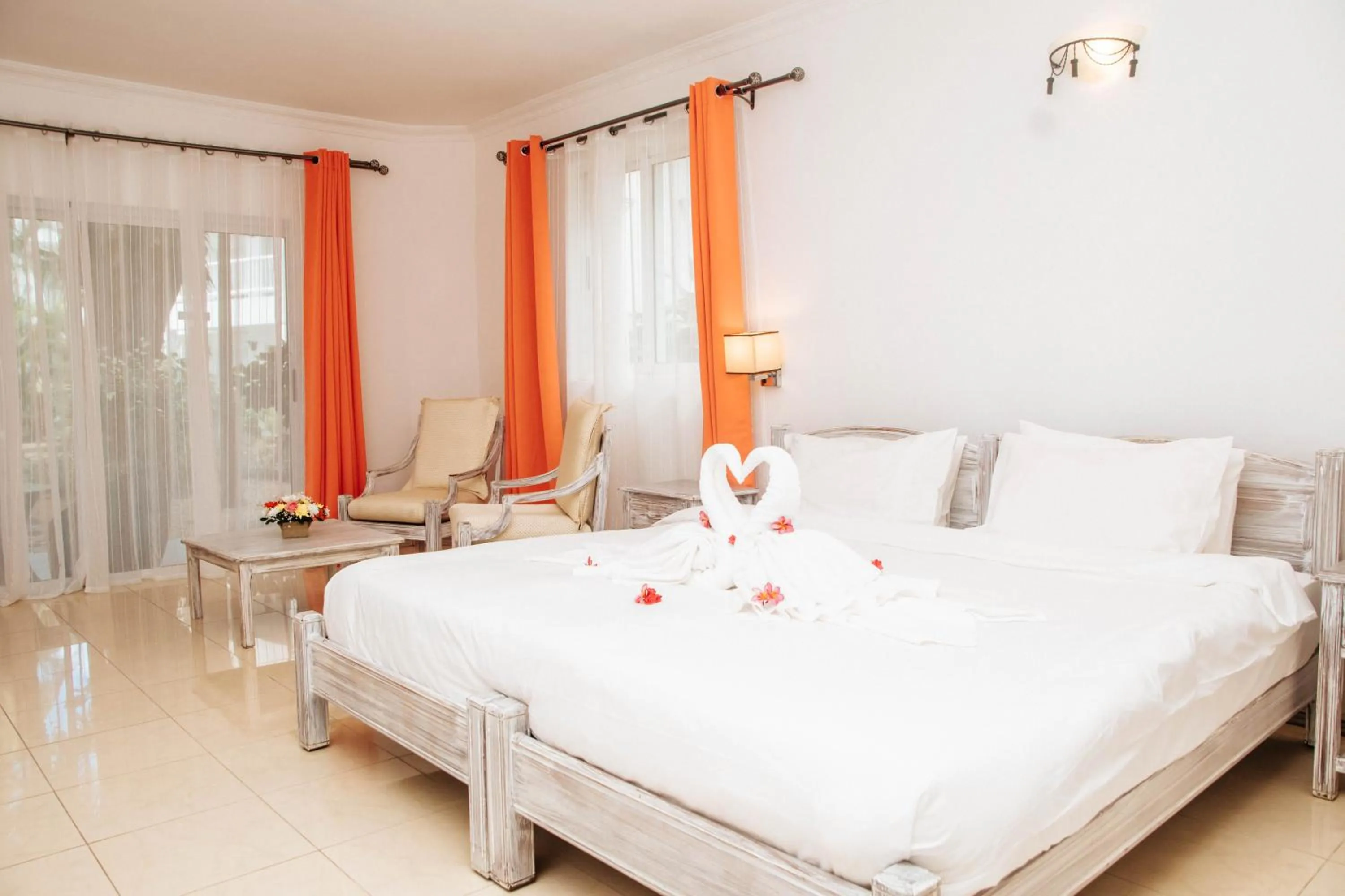 Bed in Hibiscus Boutique Hotel