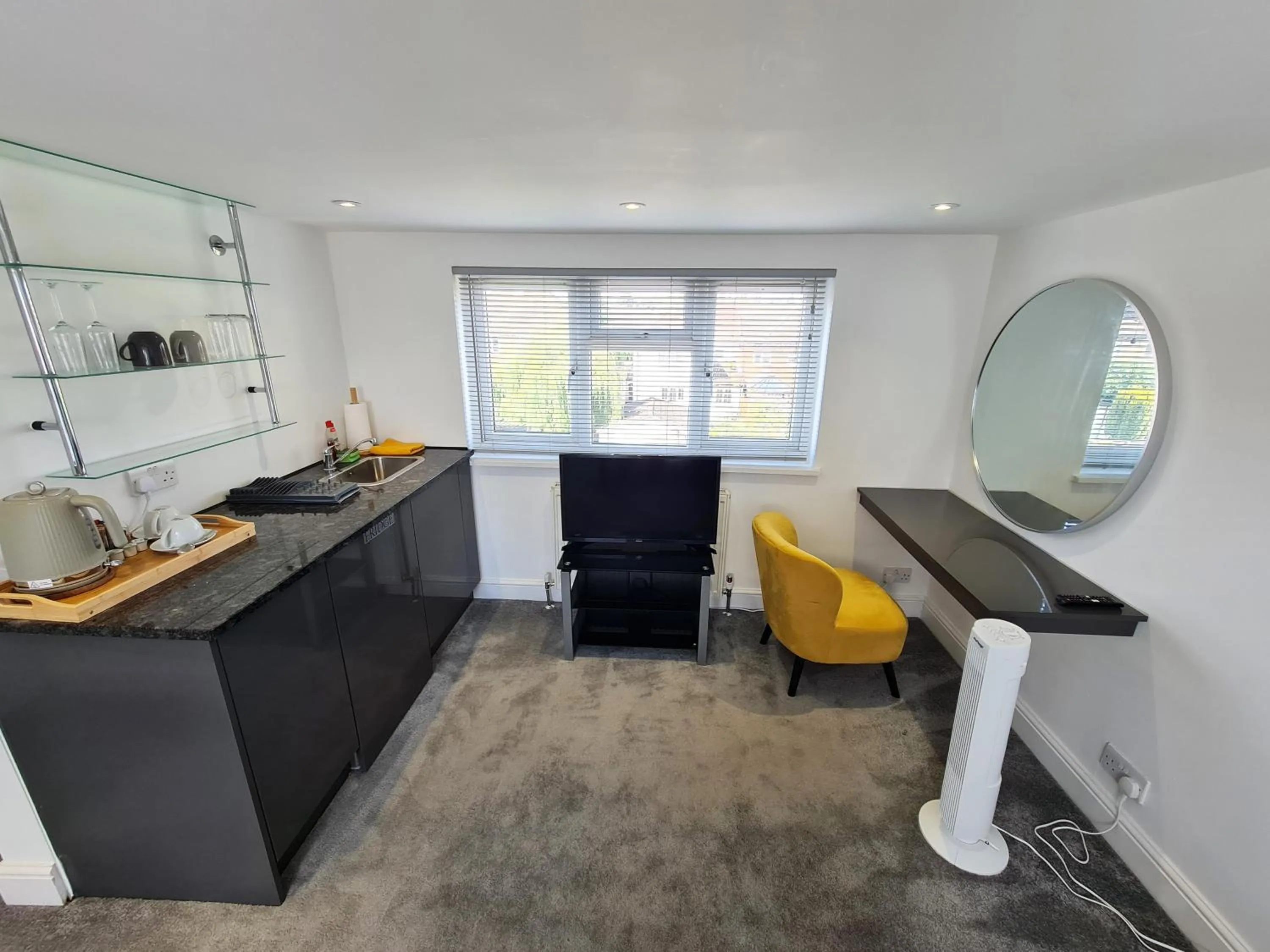 TV and multimedia in Stylish Suites with kitchenette