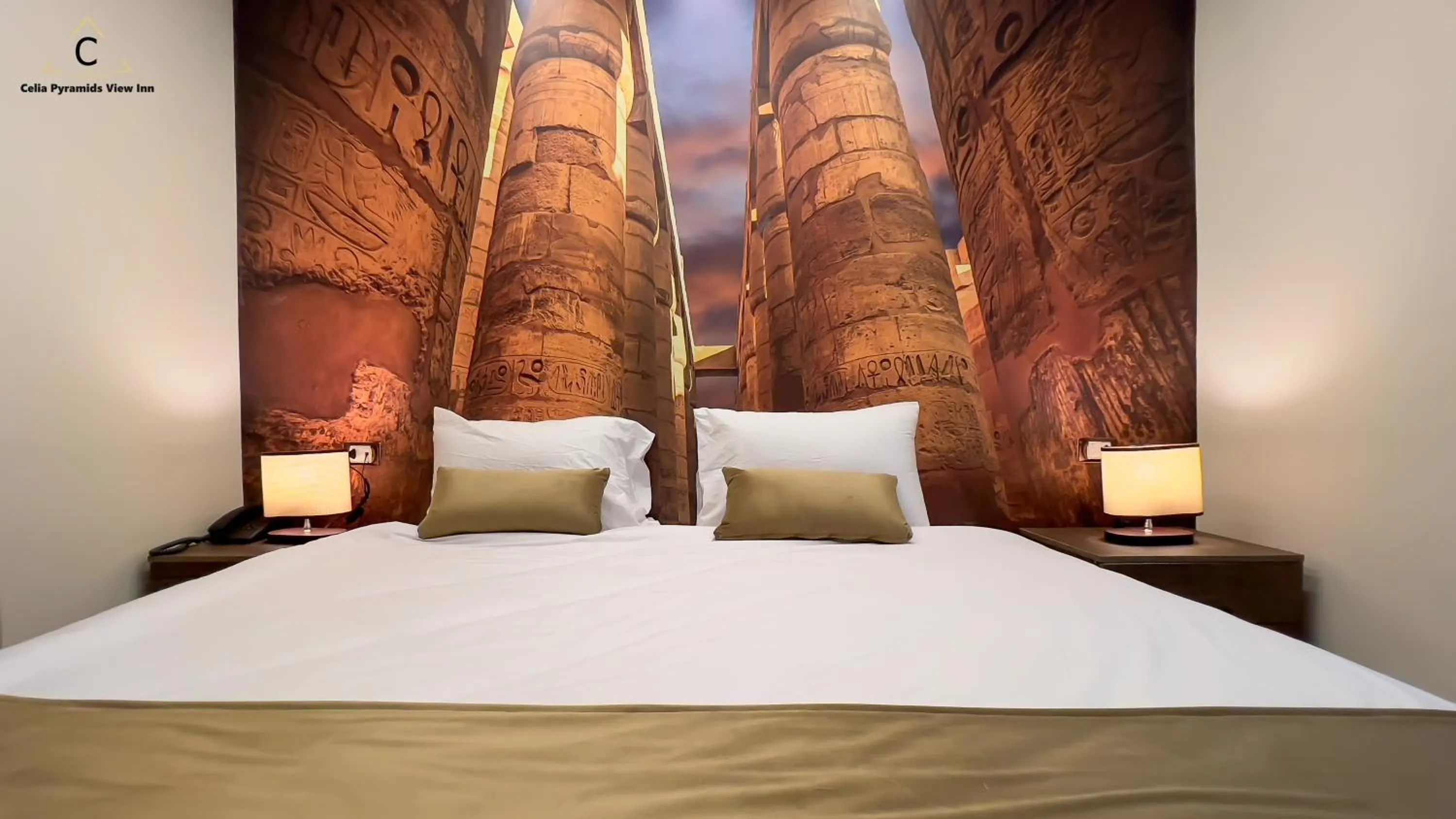 Bed in Celia Pyramids View inn