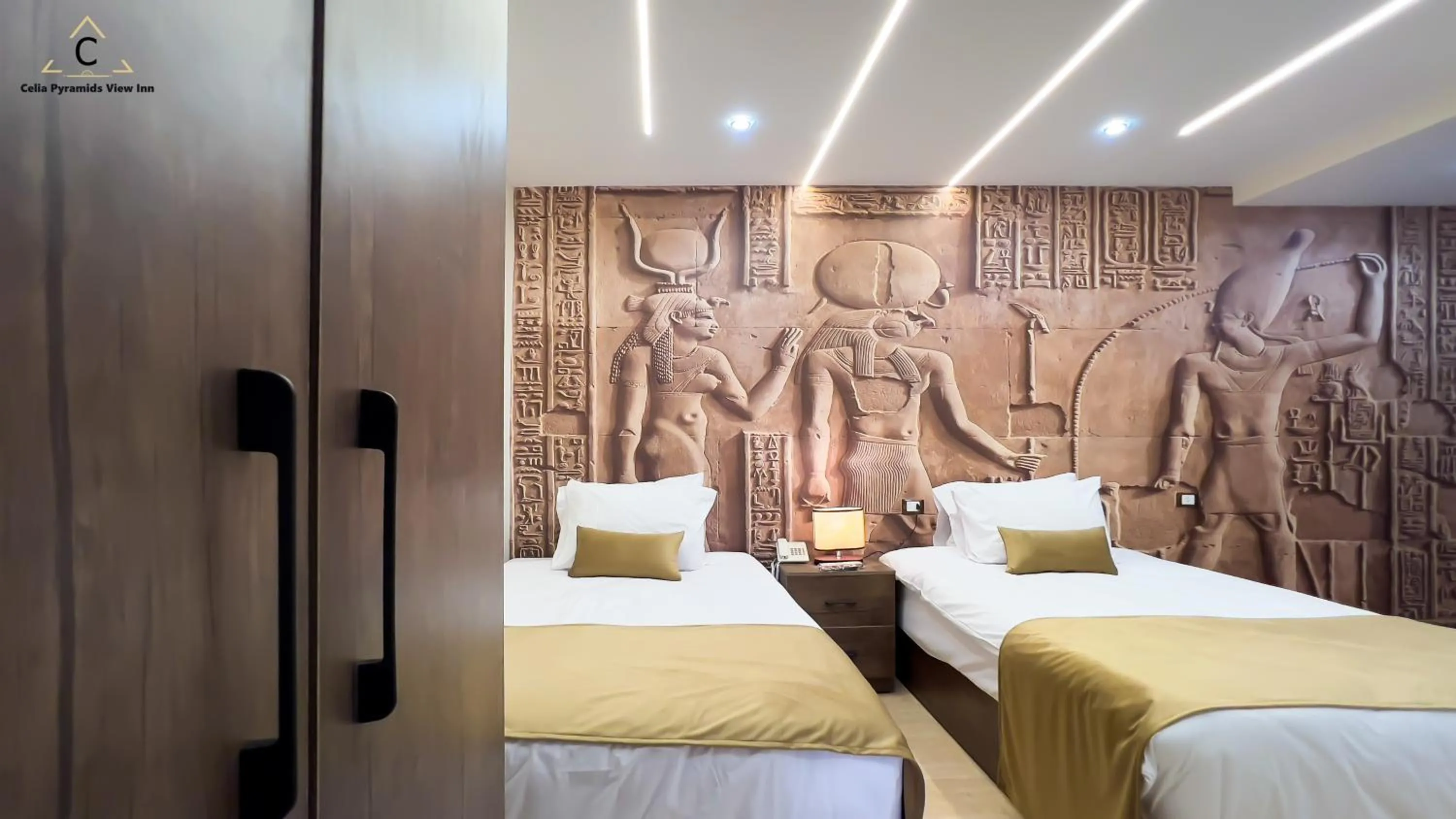 Bed in Celia Pyramids View inn