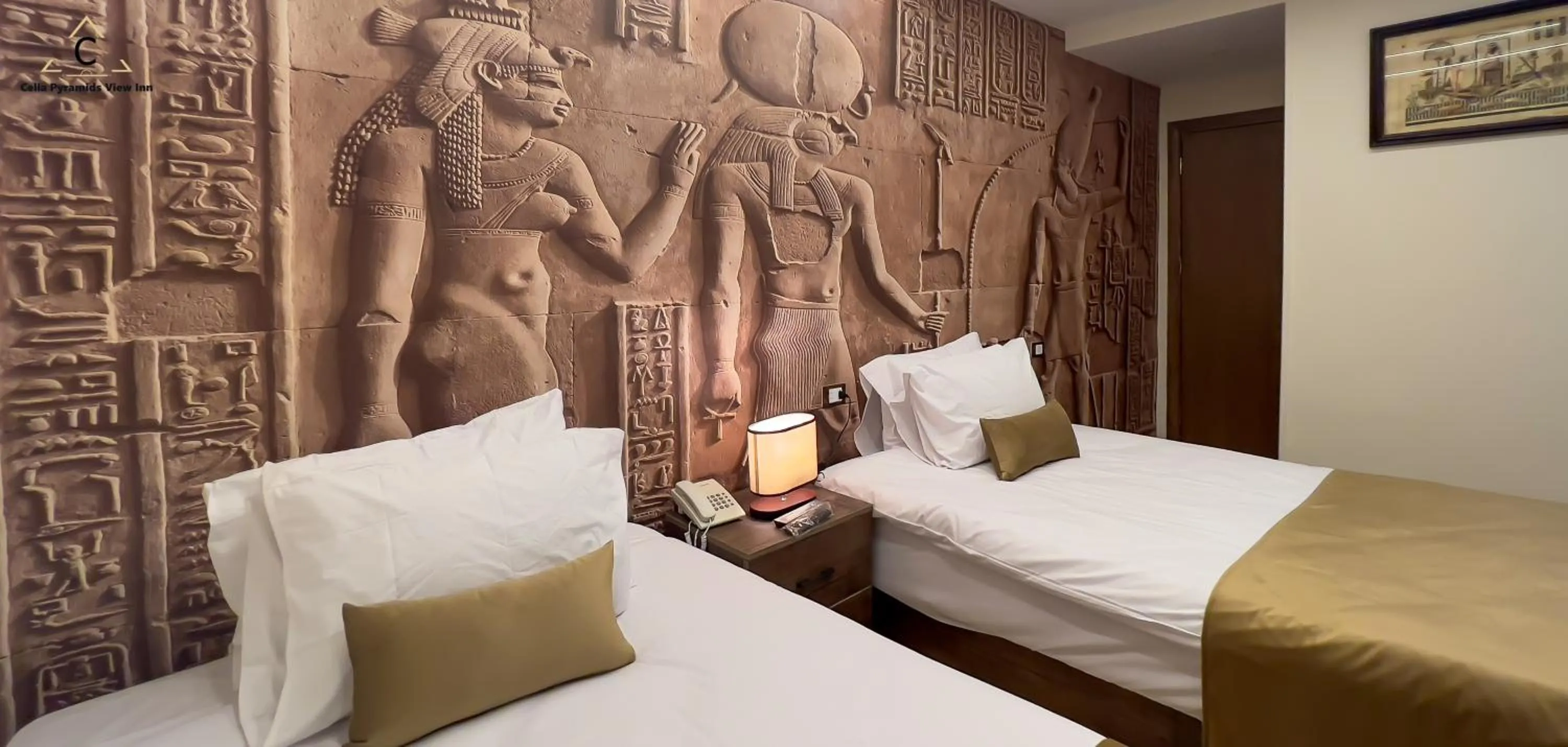 Bed in Celia Pyramids View inn