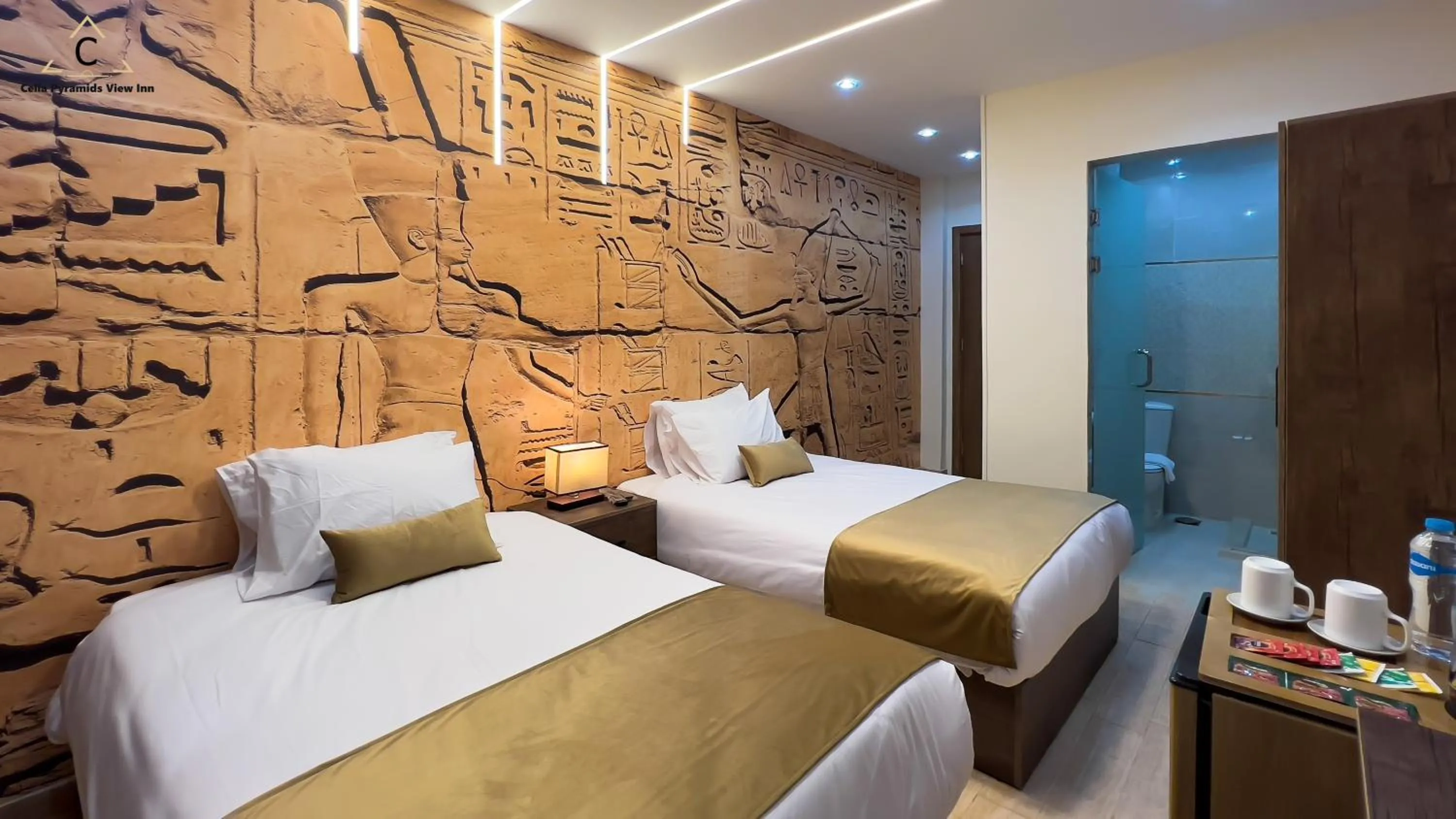 Bed in Celia Pyramids View inn