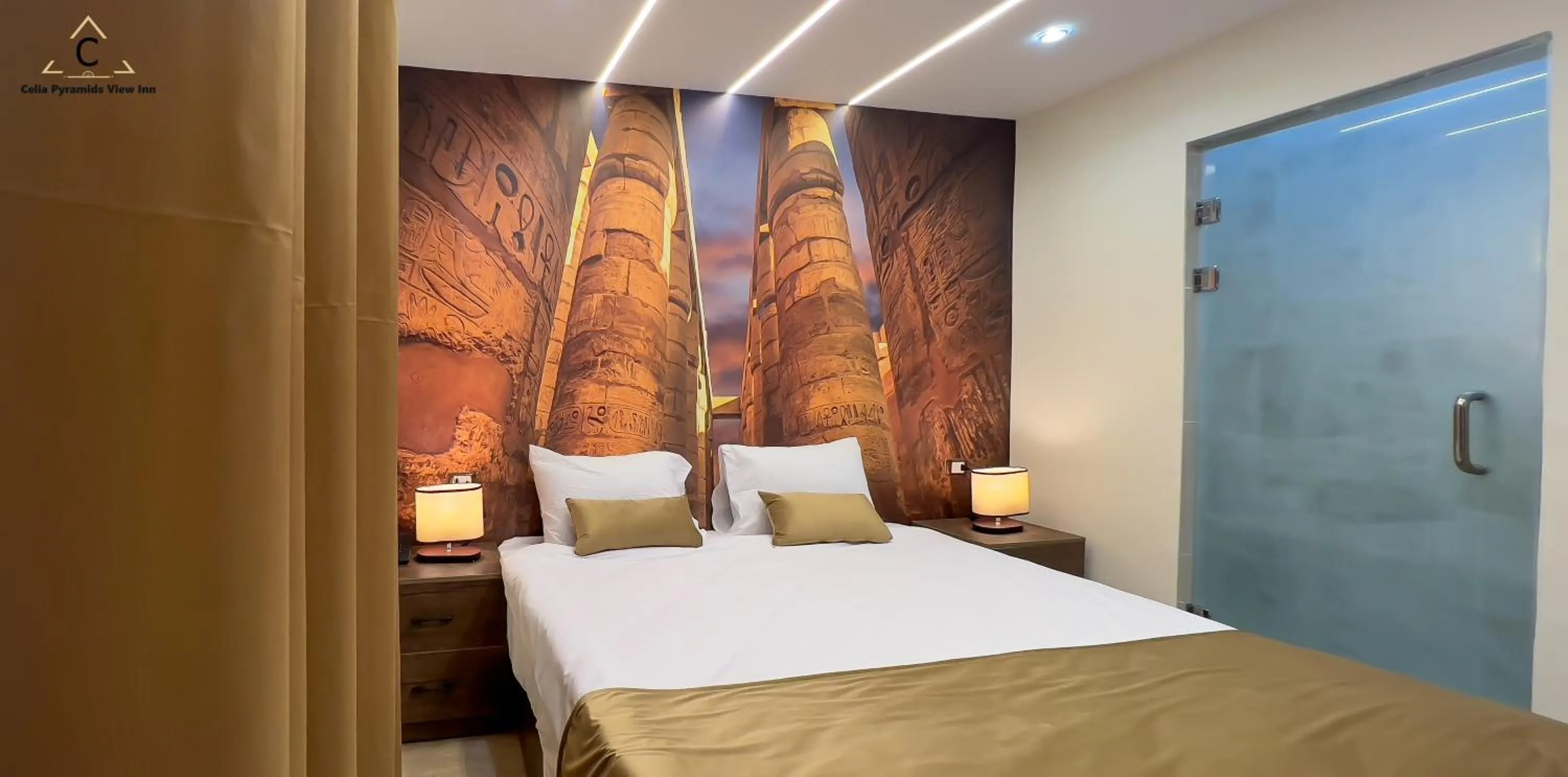 Bed in Celia Pyramids View inn