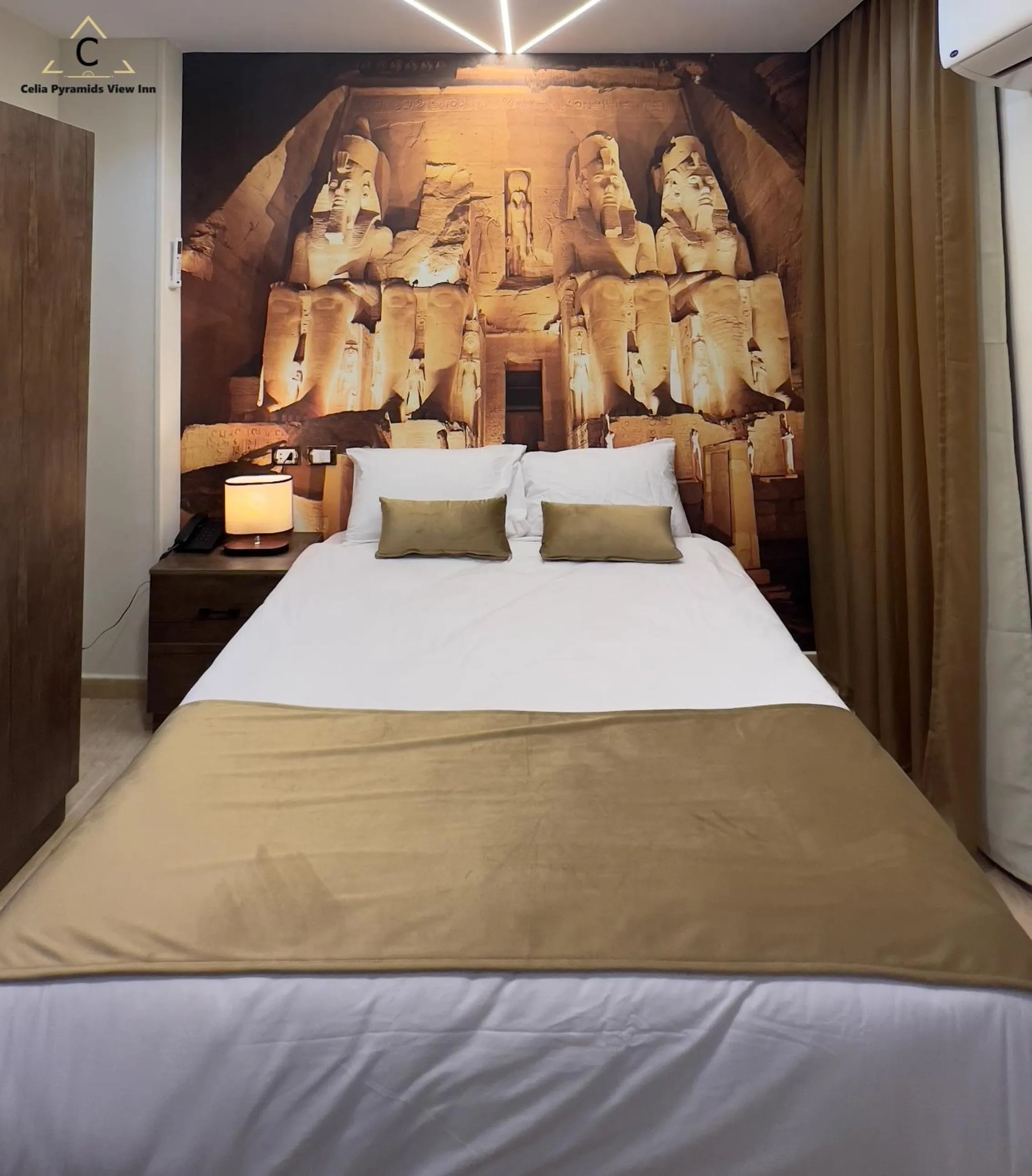 Bed in Celia Pyramids View inn