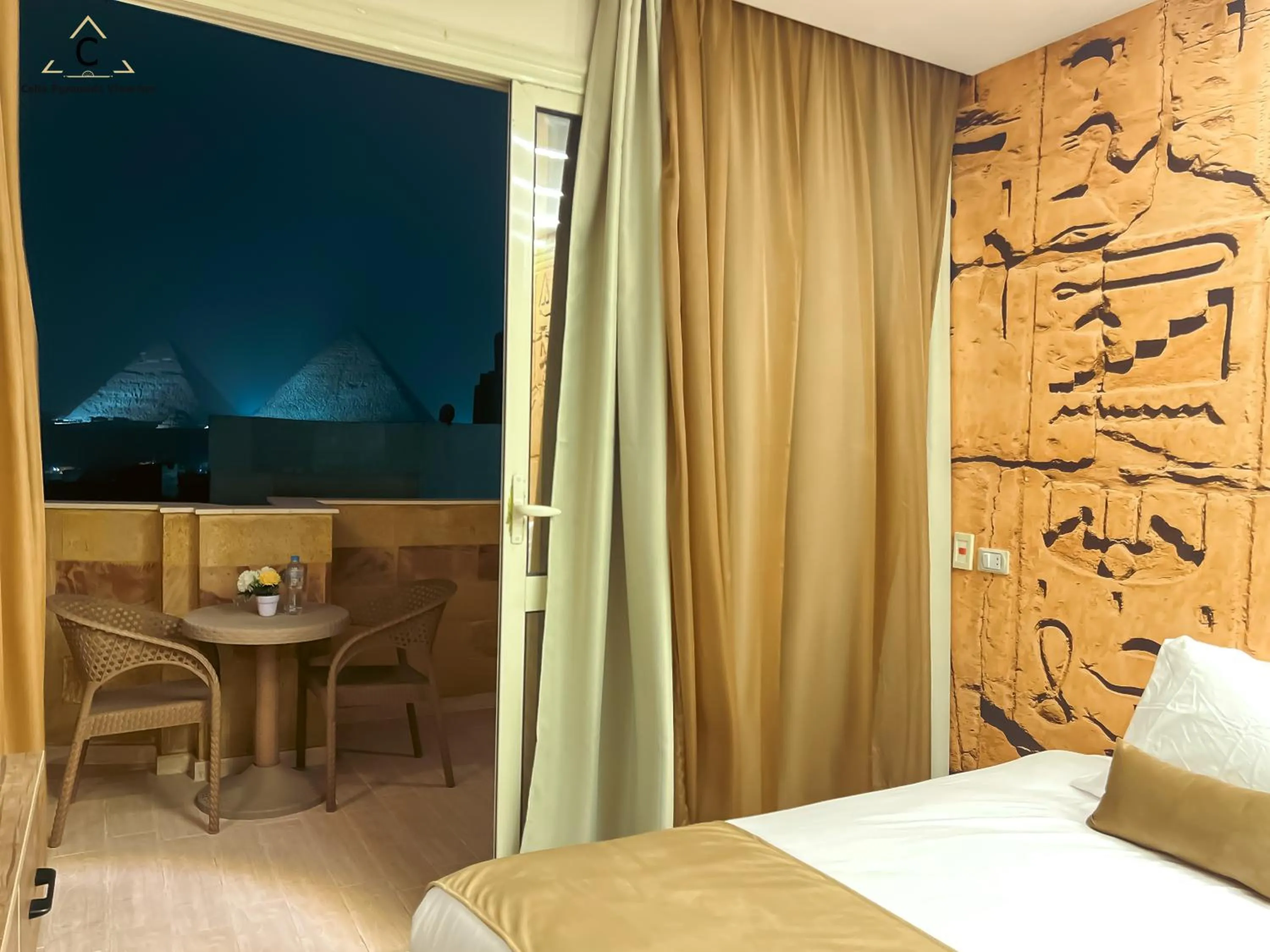 Bed in Celia Pyramids View inn