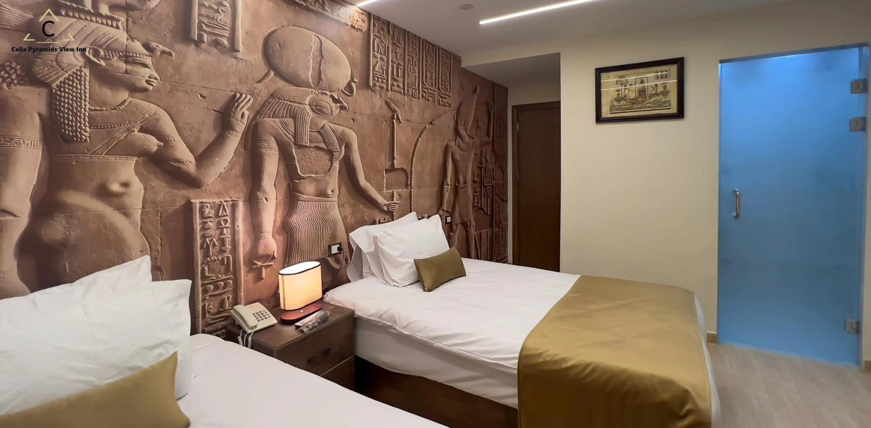 Bed in Celia Pyramids View inn