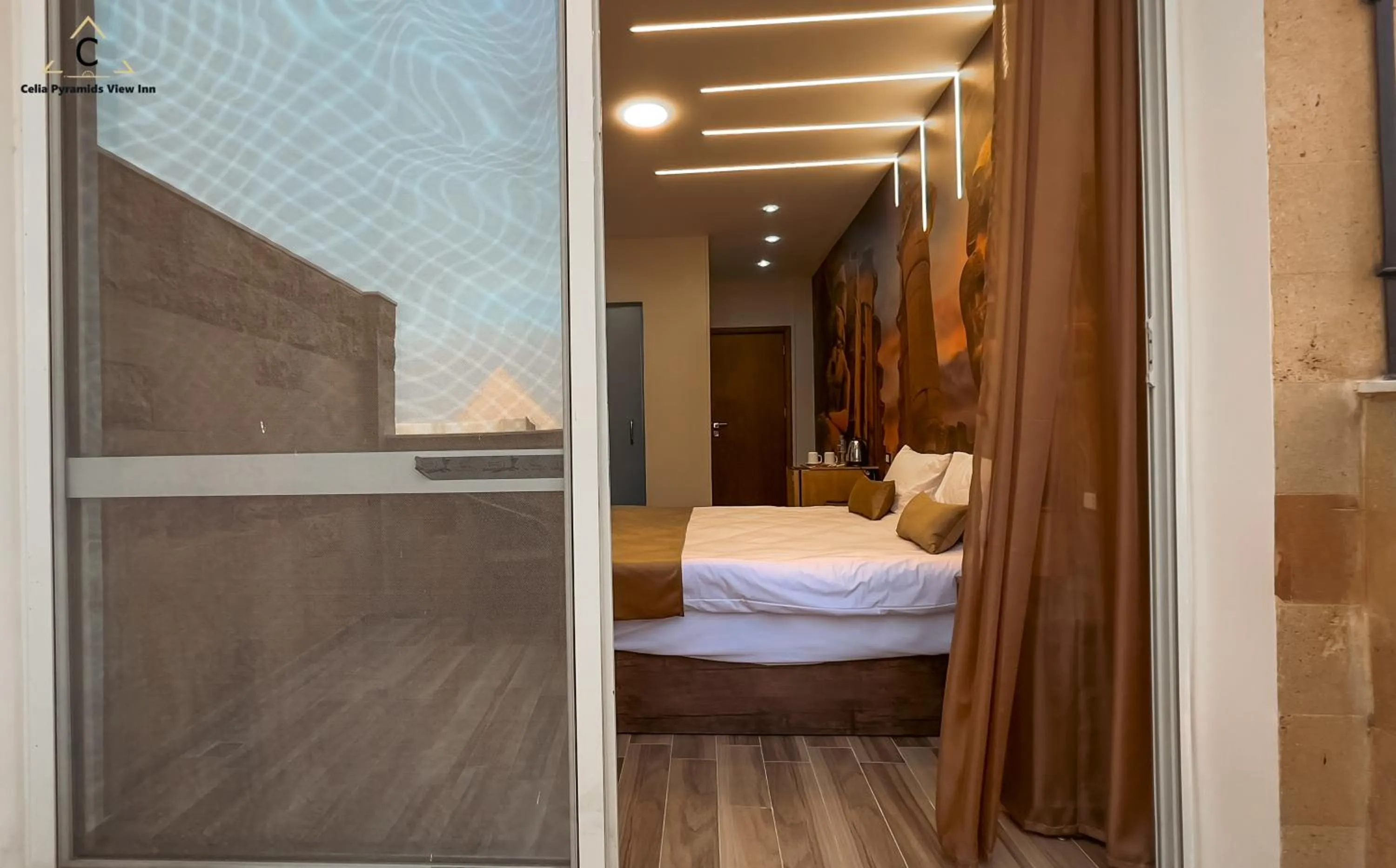 Bed in Celia Pyramids View inn