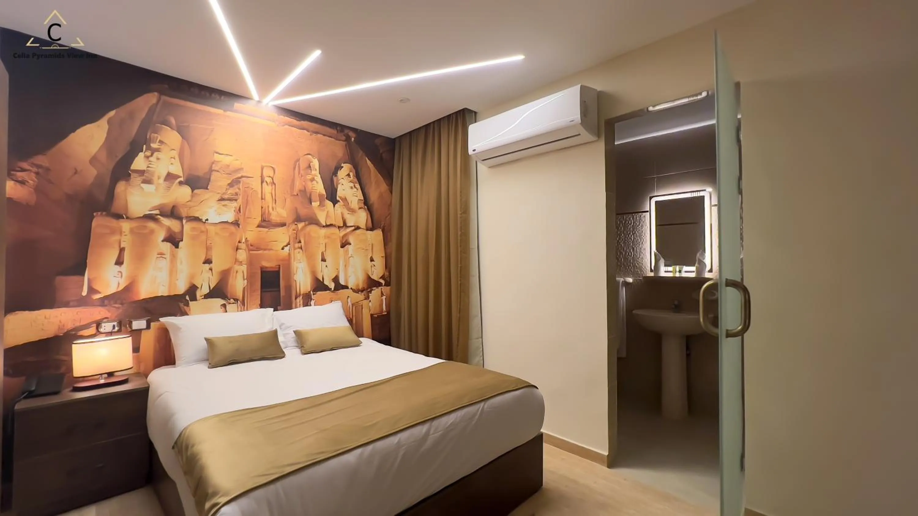 Bed in Celia Pyramids View inn