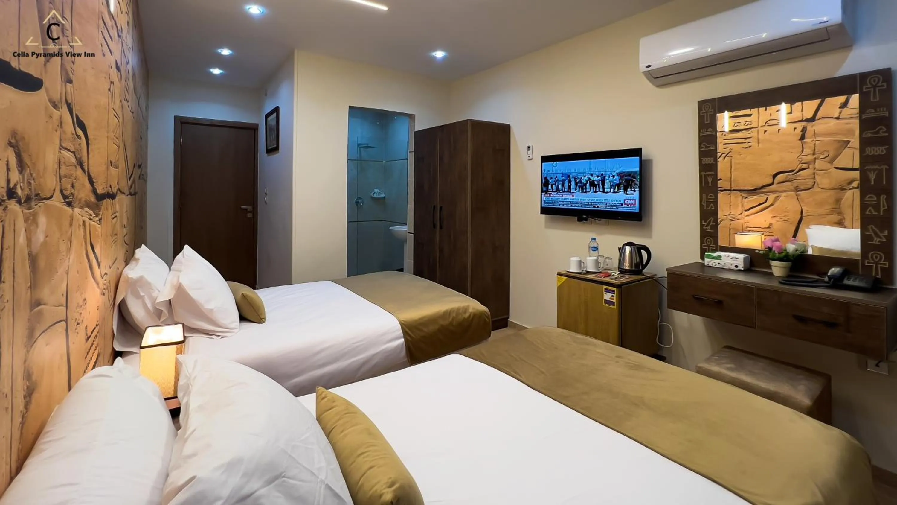 Bed in Celia Pyramids View inn