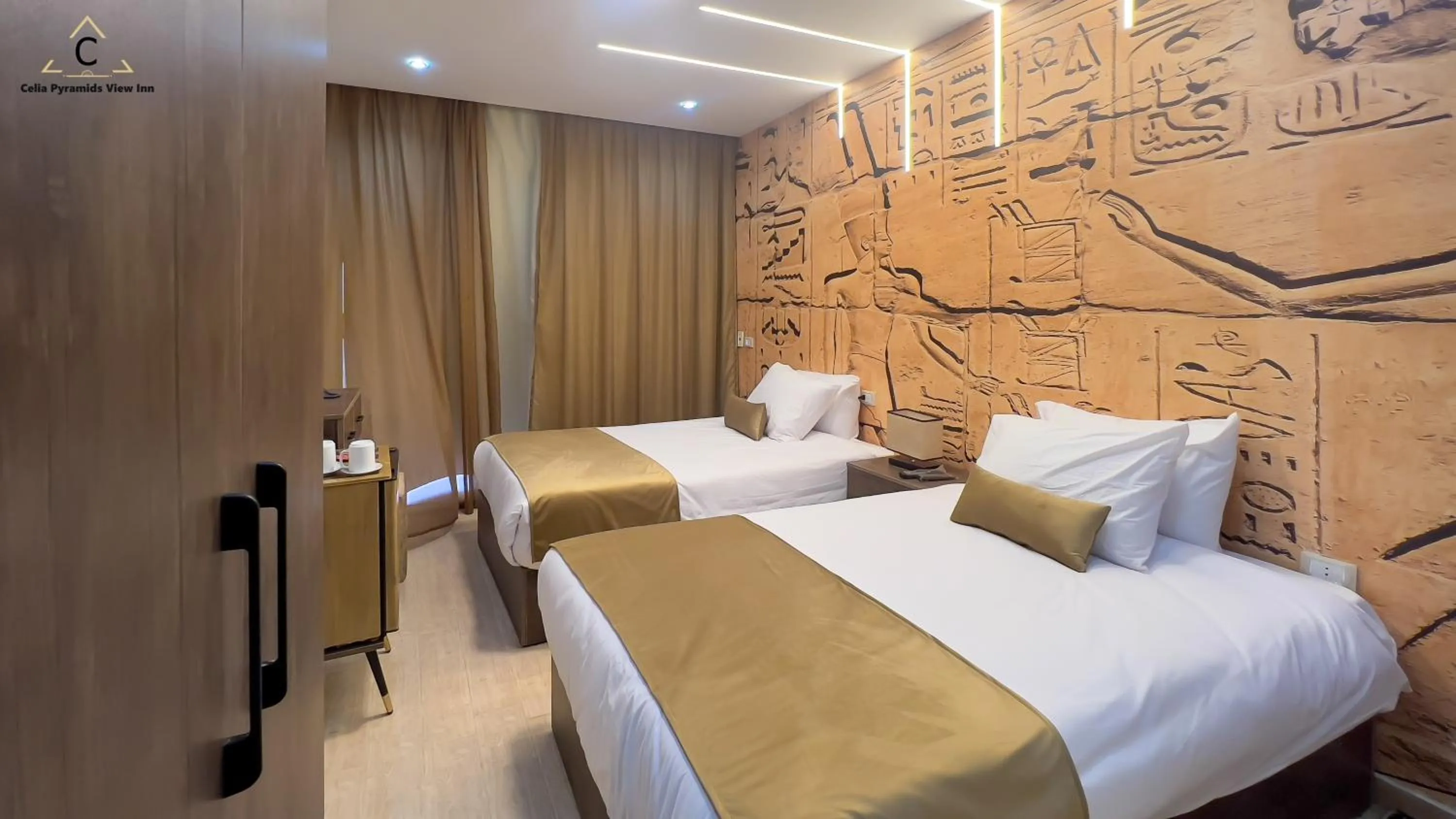 Bed in Celia Pyramids View inn