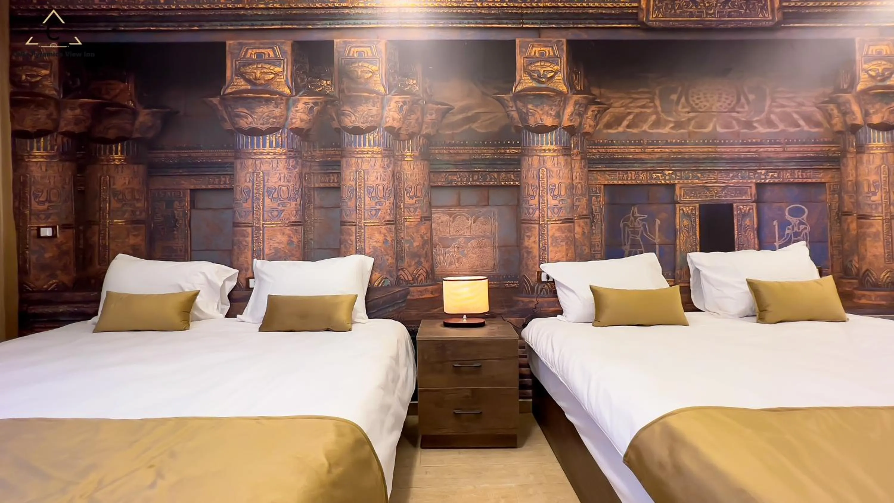 Bed in Celia Pyramids View inn