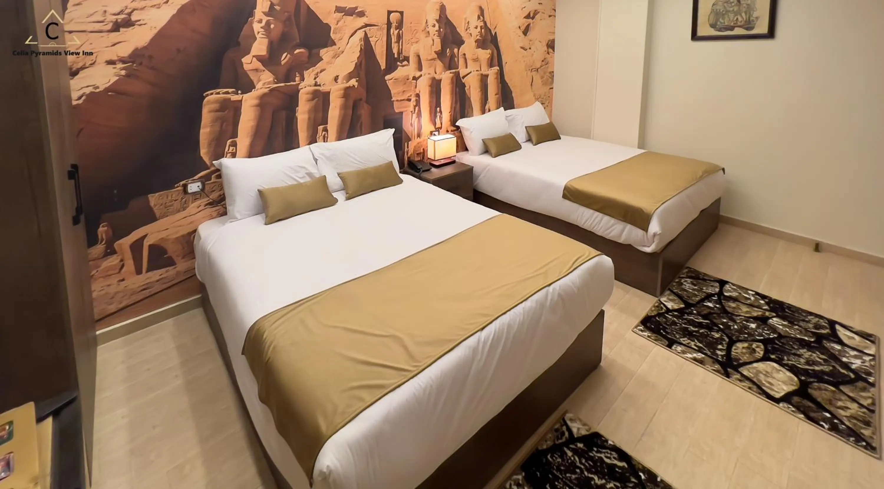 Bed in Celia Pyramids View inn