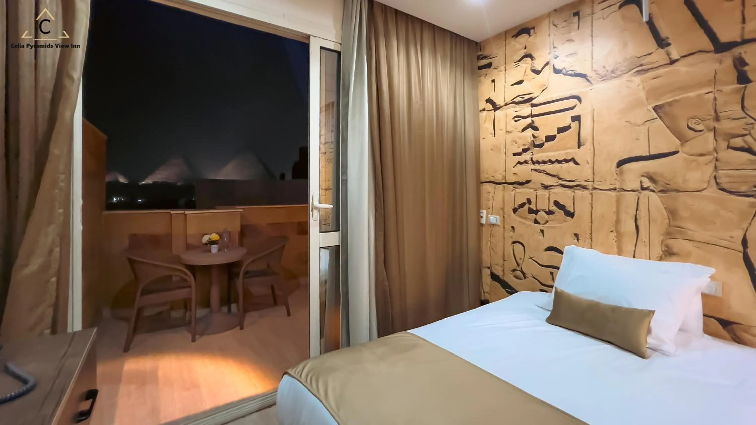 Bed in Celia Pyramids View inn