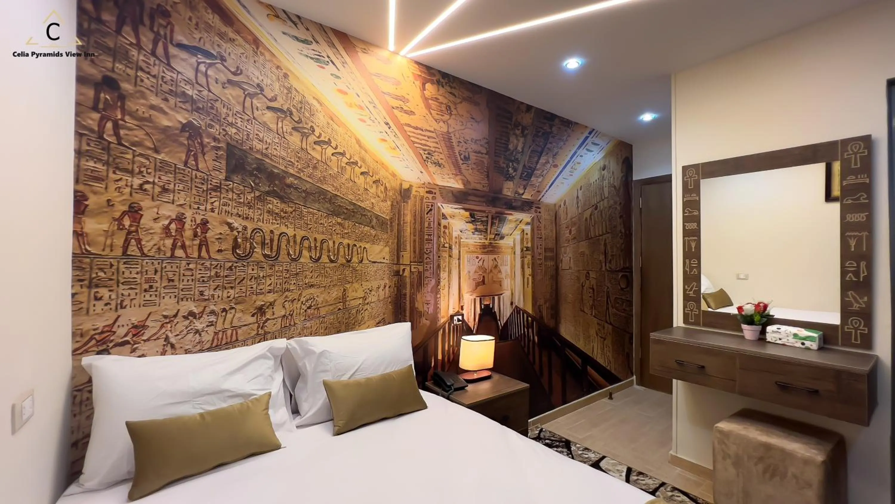 Bed in Celia Pyramids View inn