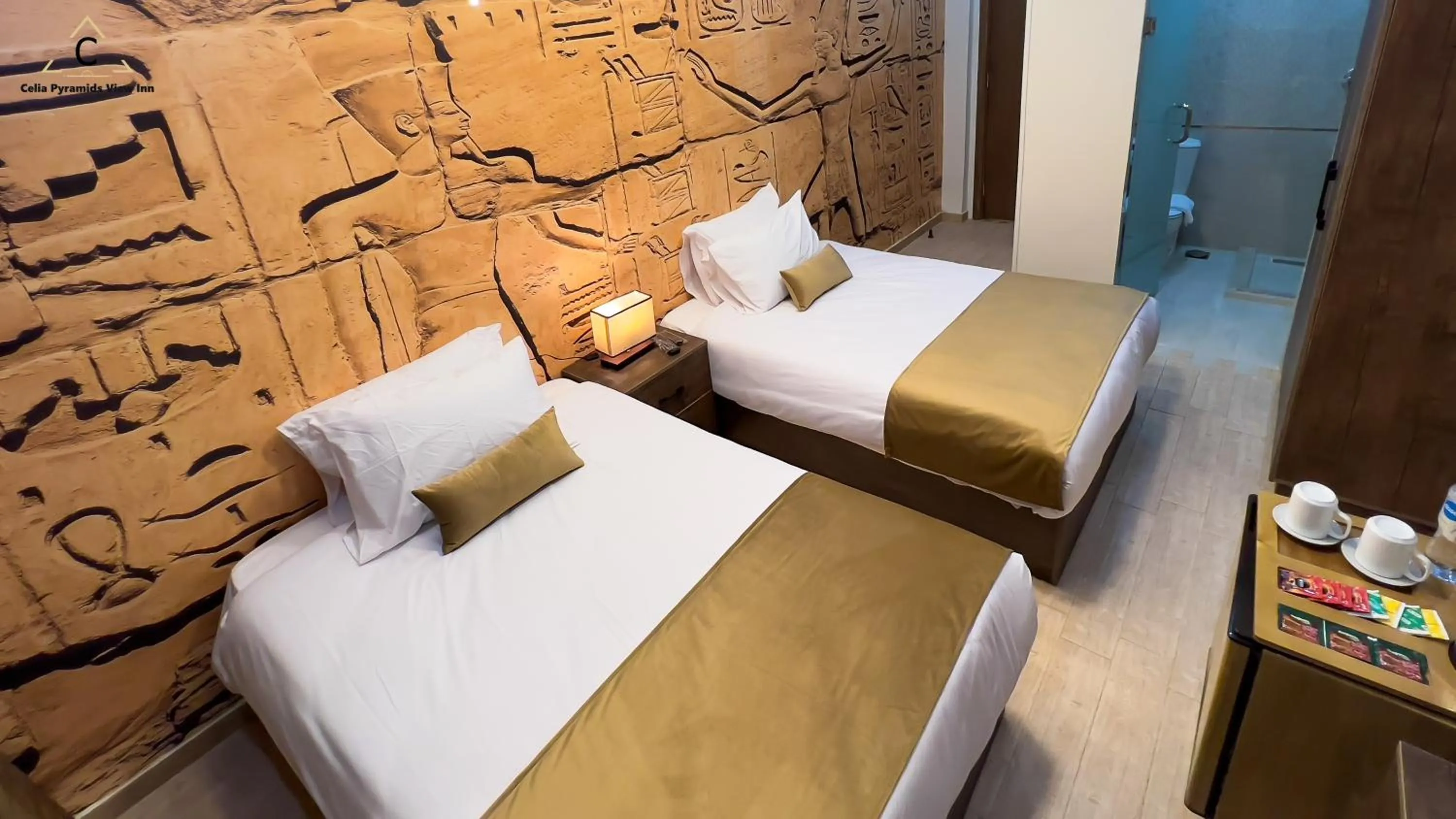 Bed in Celia Pyramids View inn