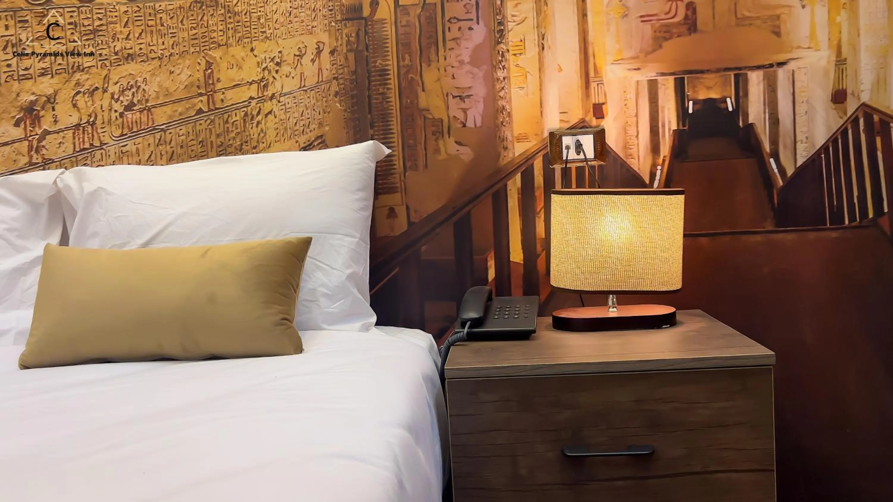 Bed in Celia Pyramids View inn