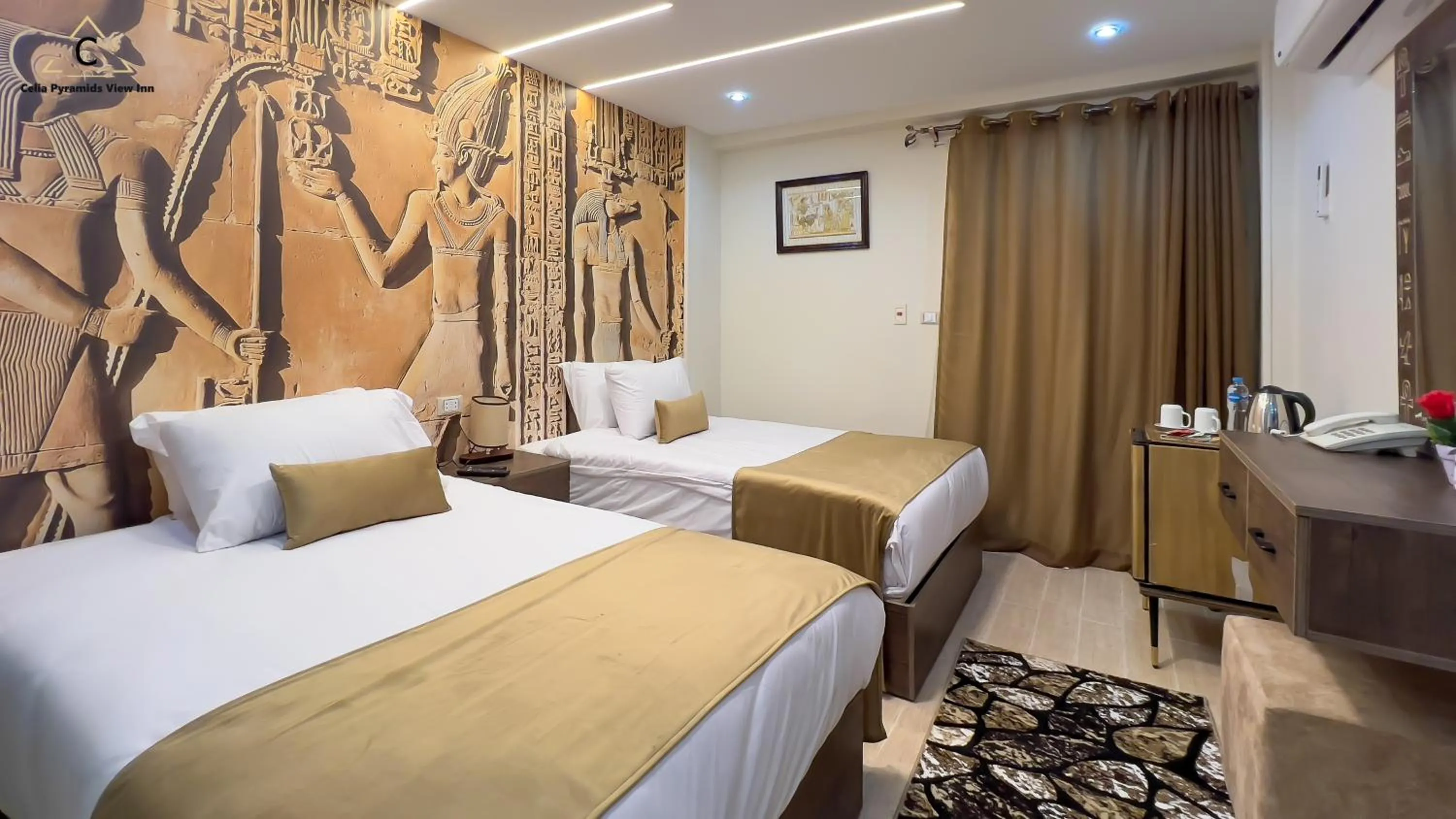 Bed in Celia Pyramids View inn