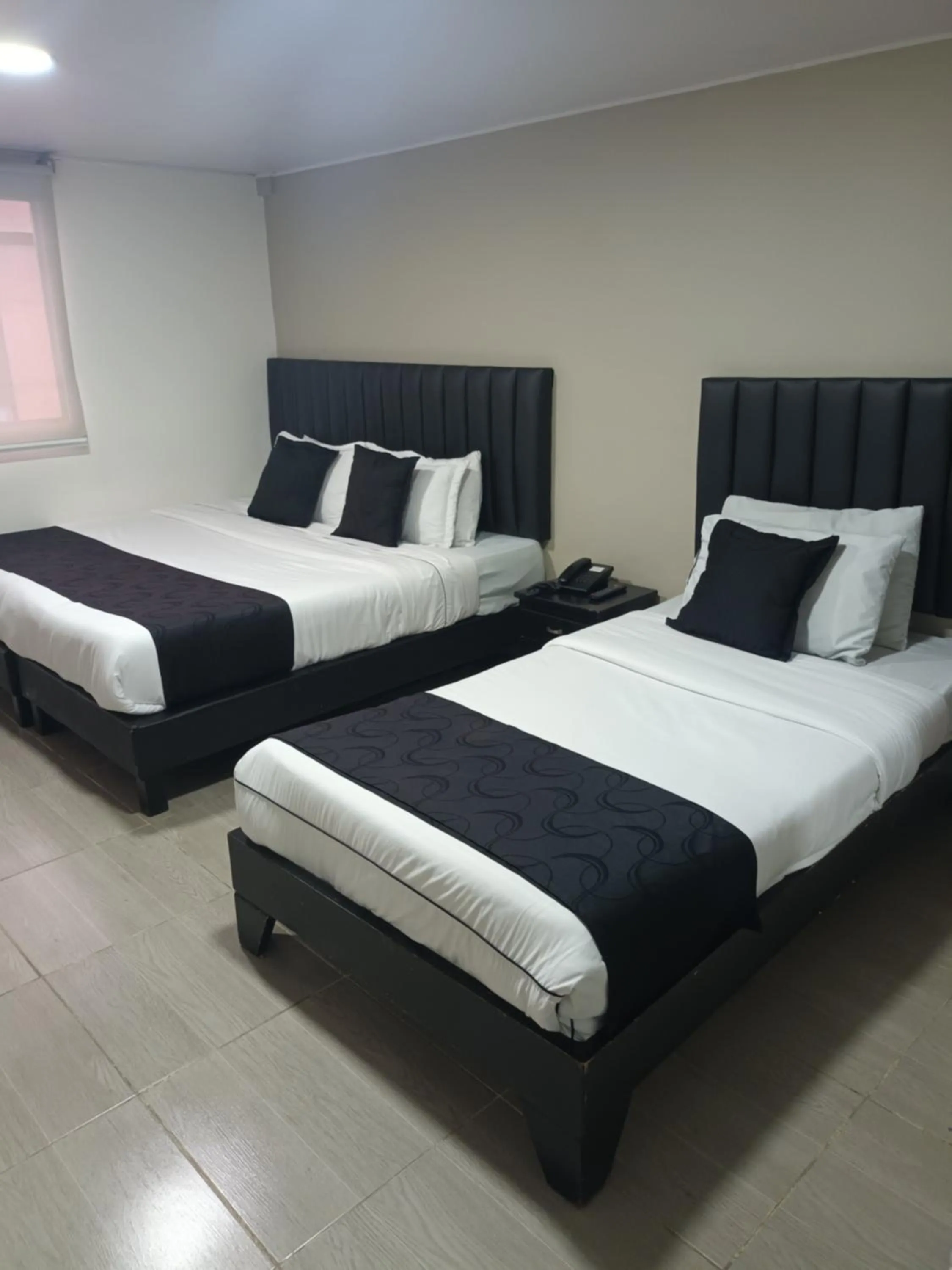 Bed in Hotel Santiago Plaza