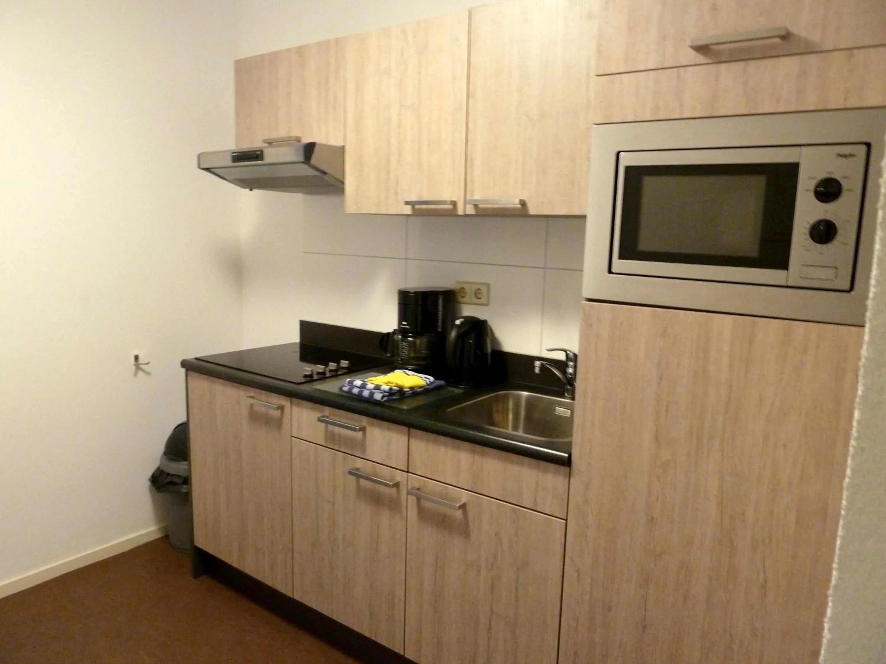 Kitchen or kitchenette in Nicolette Apartments