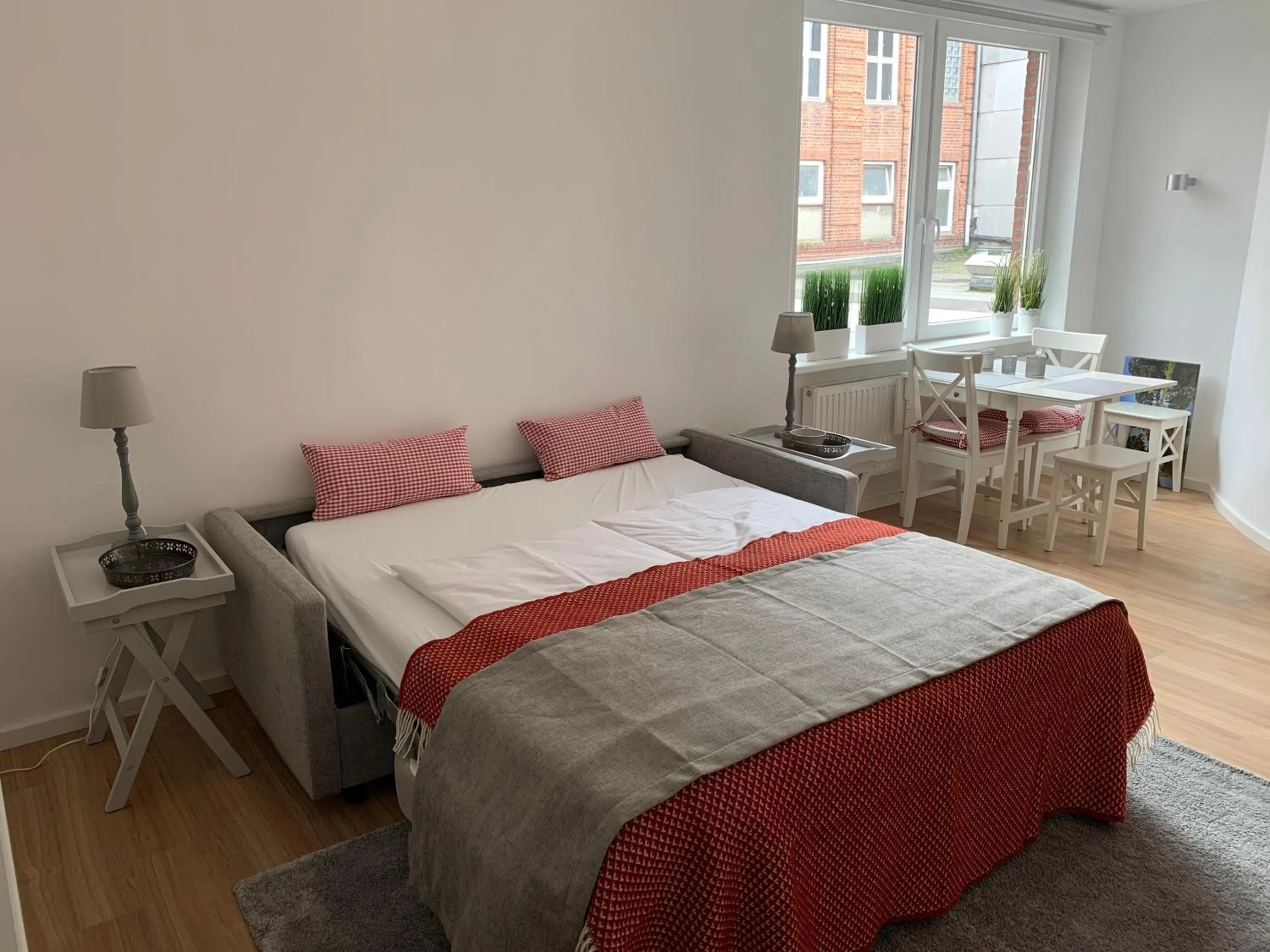Bed in Luxx City Apartments