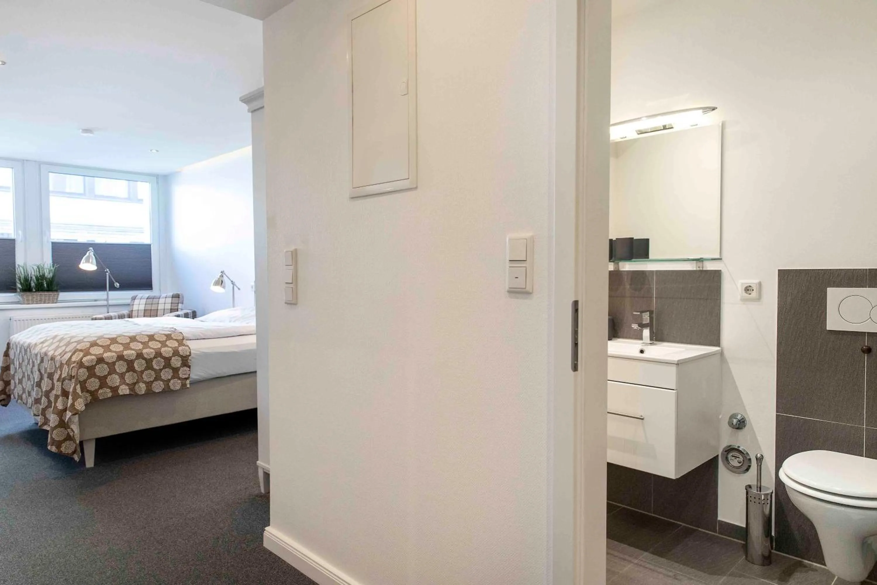 Bed in Luxx City Apartments