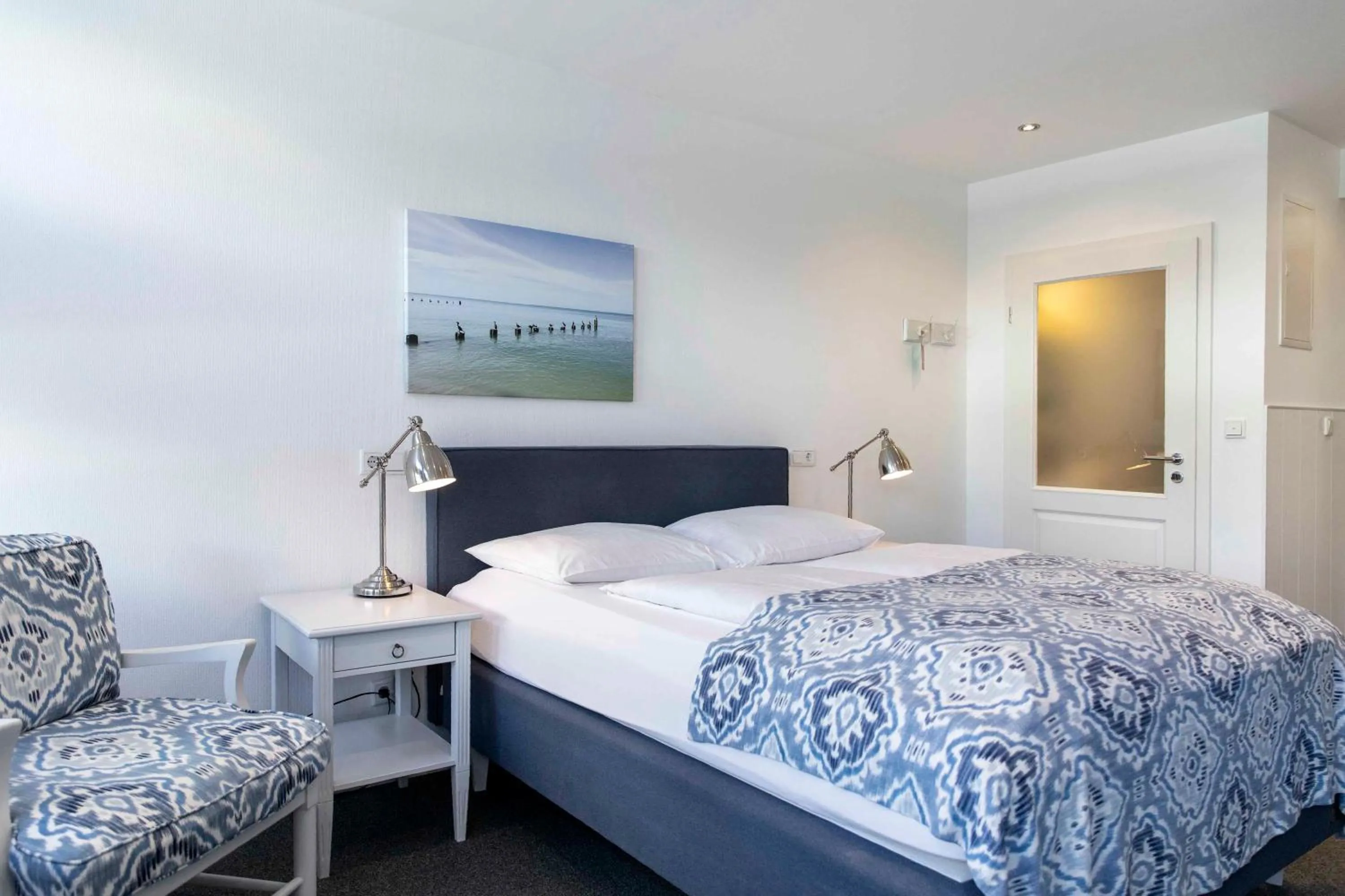 Bed in Luxx City Apartments