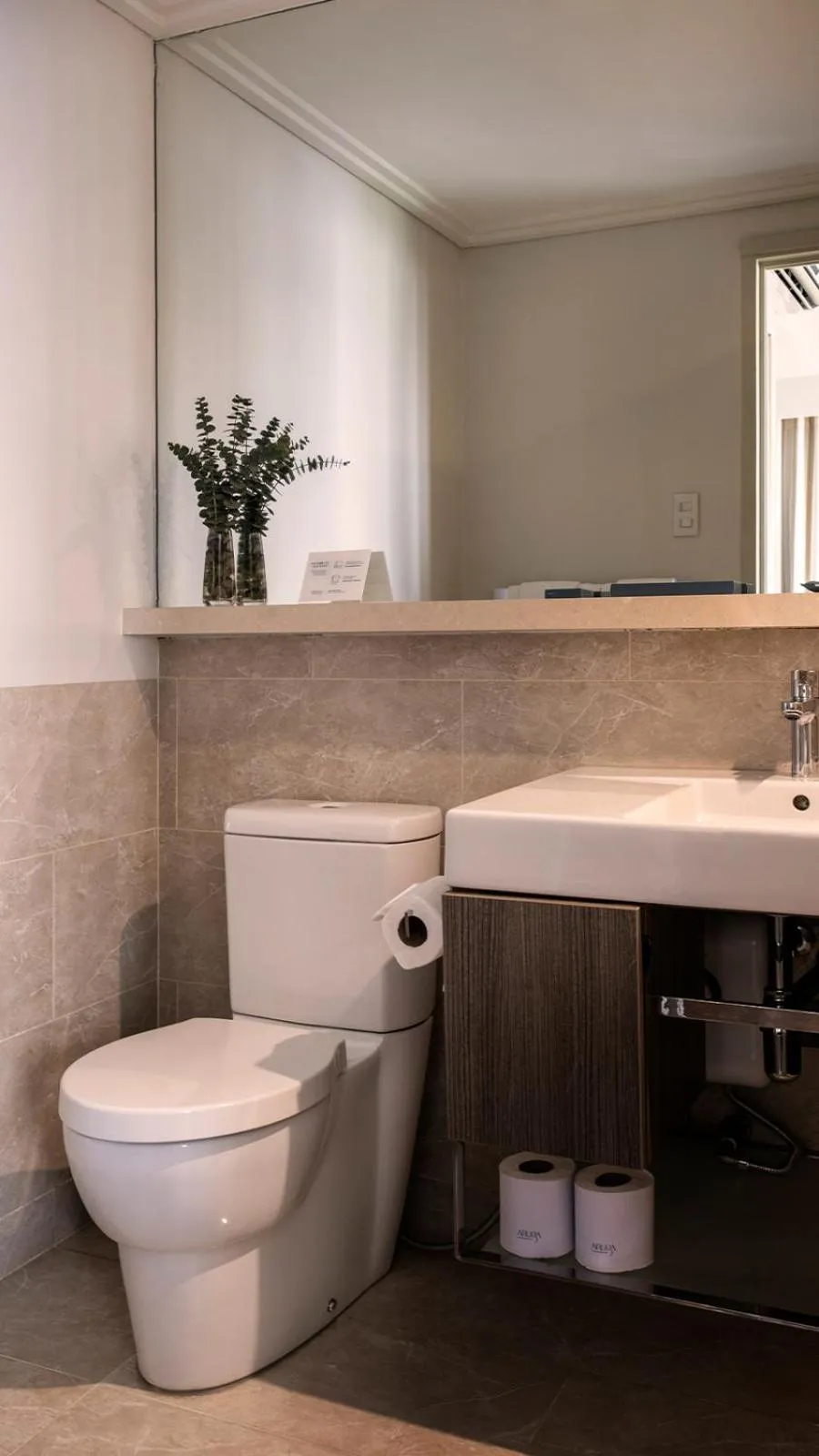 Toilet in Aruga Apartments by Rockwell Makati