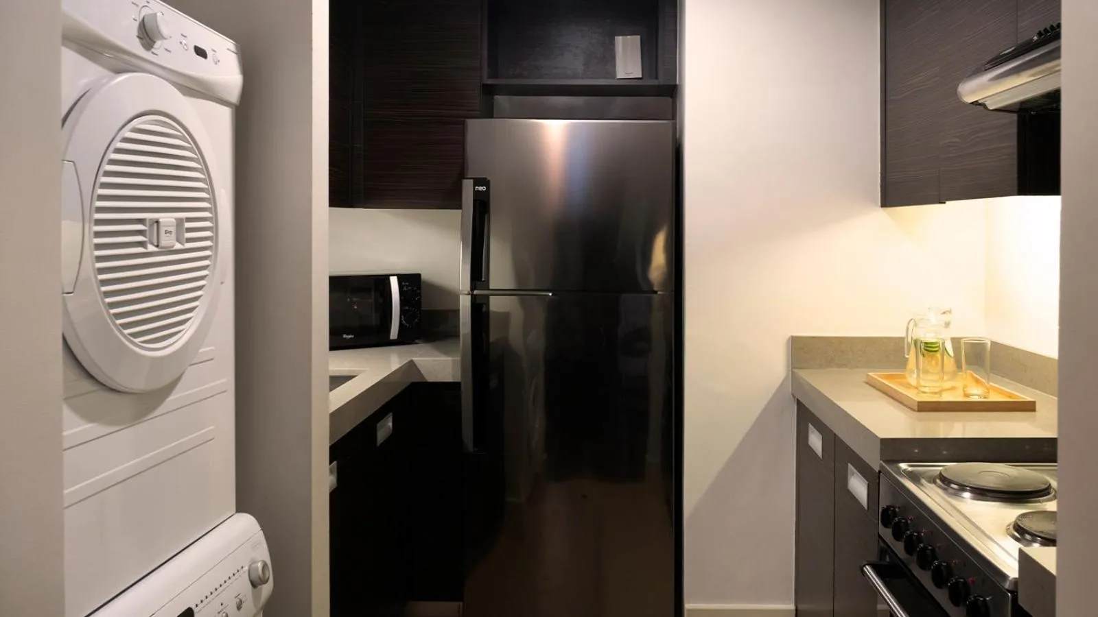 Kitchen or kitchenette in Aruga Apartments by Rockwell Makati