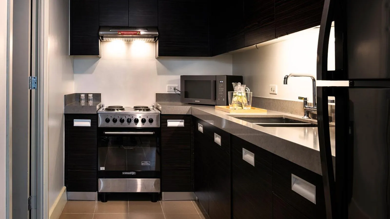 Kitchen or kitchenette in Aruga Apartments by Rockwell Makati