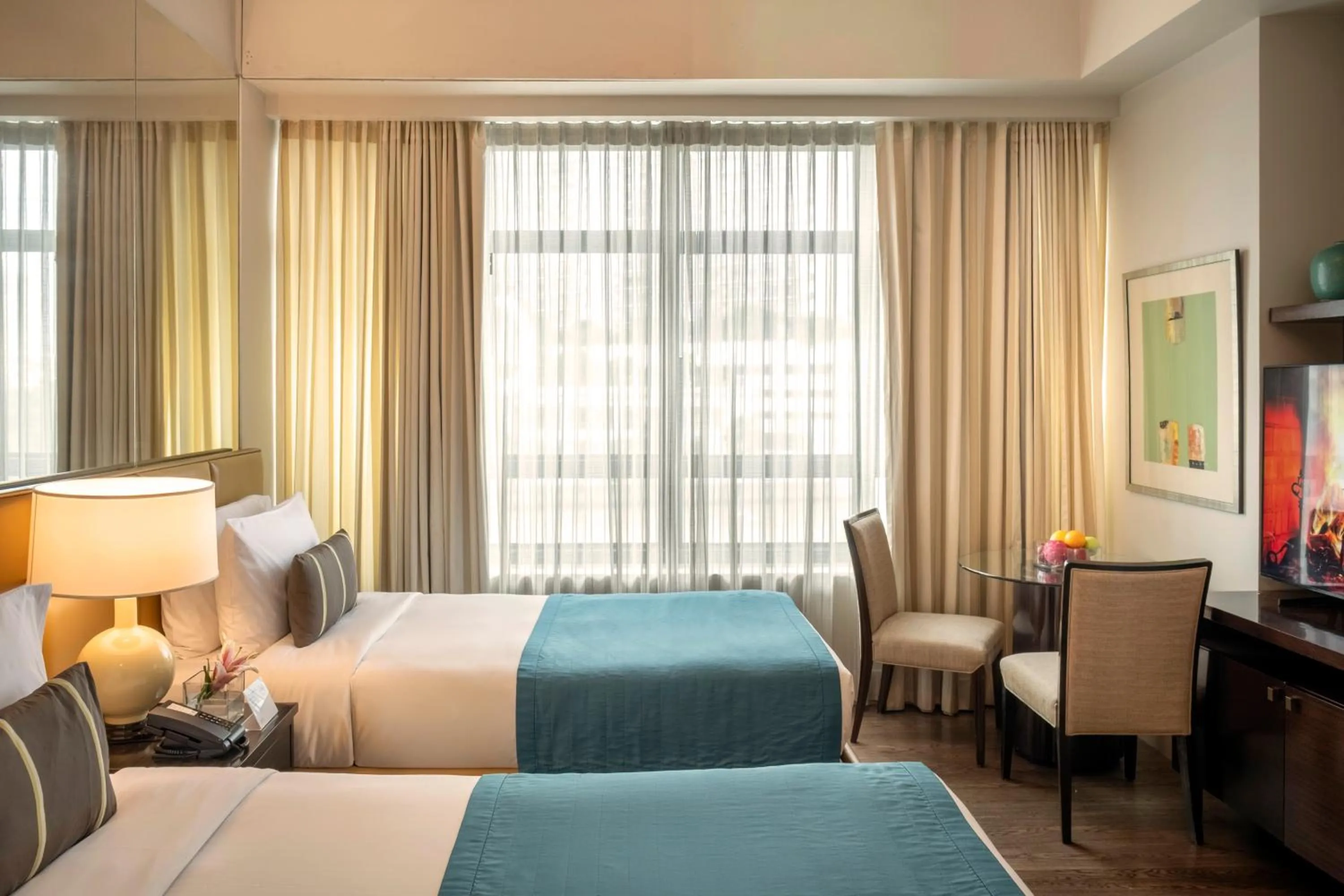 Bed in Aruga Apartments by Rockwell Makati