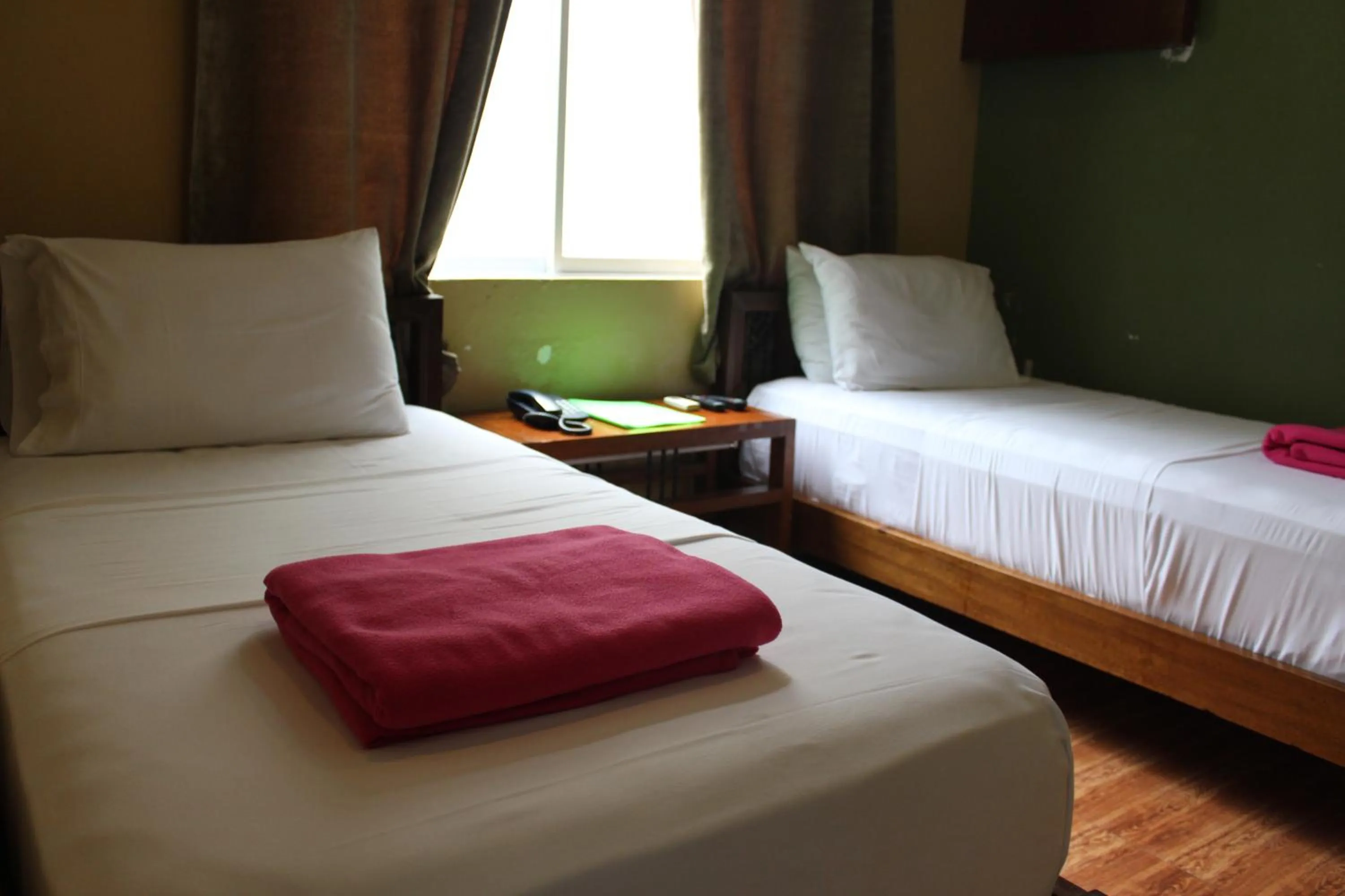 Bed in Purple Tree Bed & Breakfast