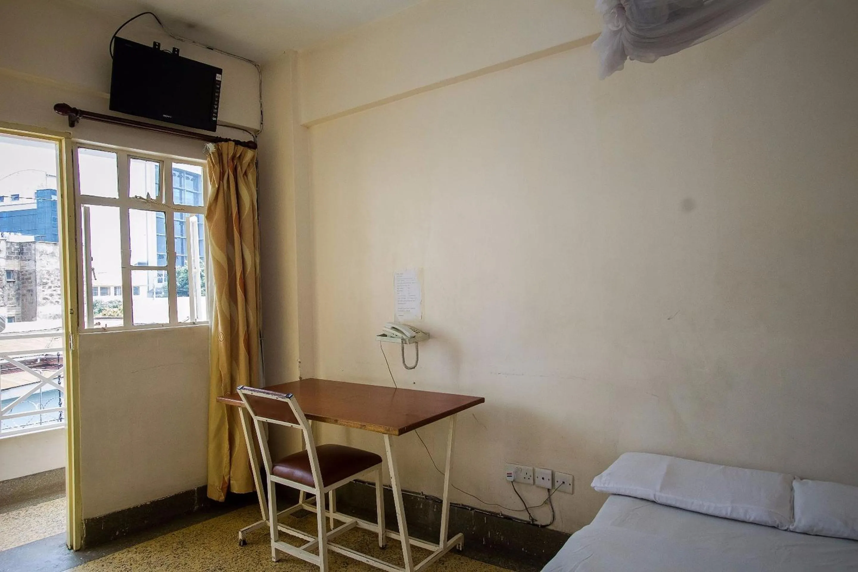 Seating area, Bed in Rabi Hotel