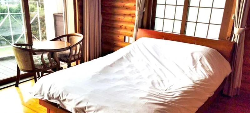 Bed in Jeju Land Pension