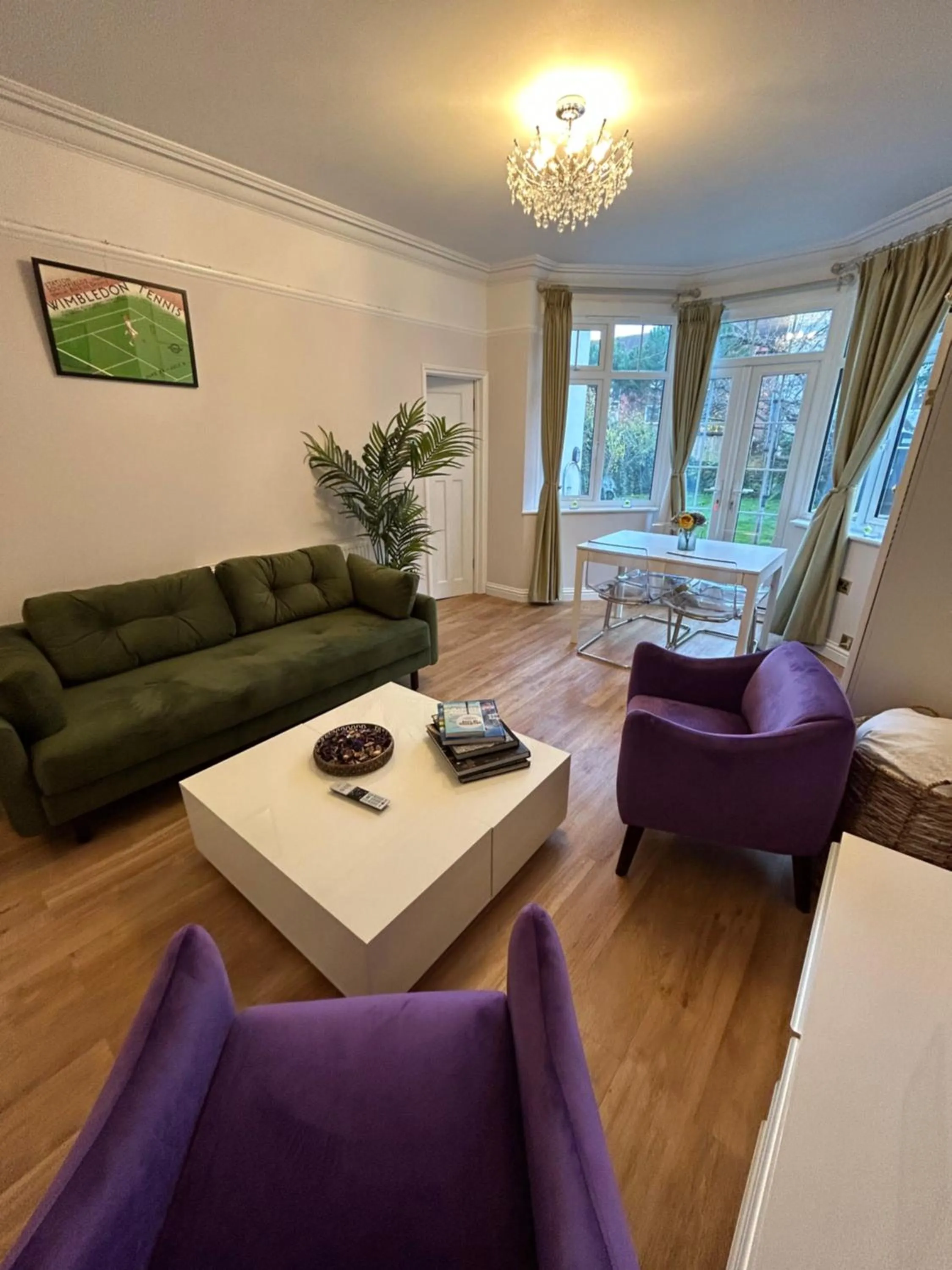 Living room, Bed in Lovely garden apartment in Wimbledon Town Centre with private parking by Wimbledon Holiday Lets