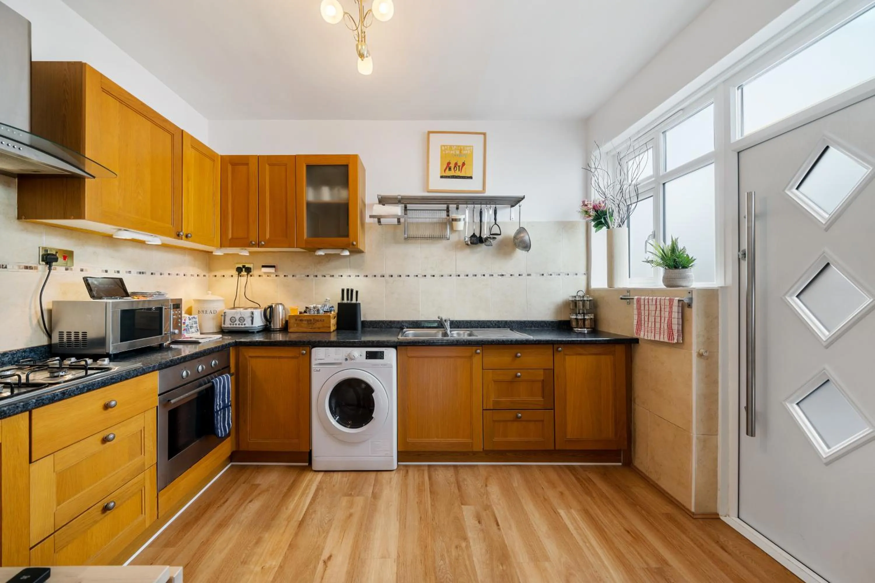 Kitchen or kitchenette in Lovely garden apartment in Wimbledon Town Centre with private parking by Wimbledon Holiday Lets