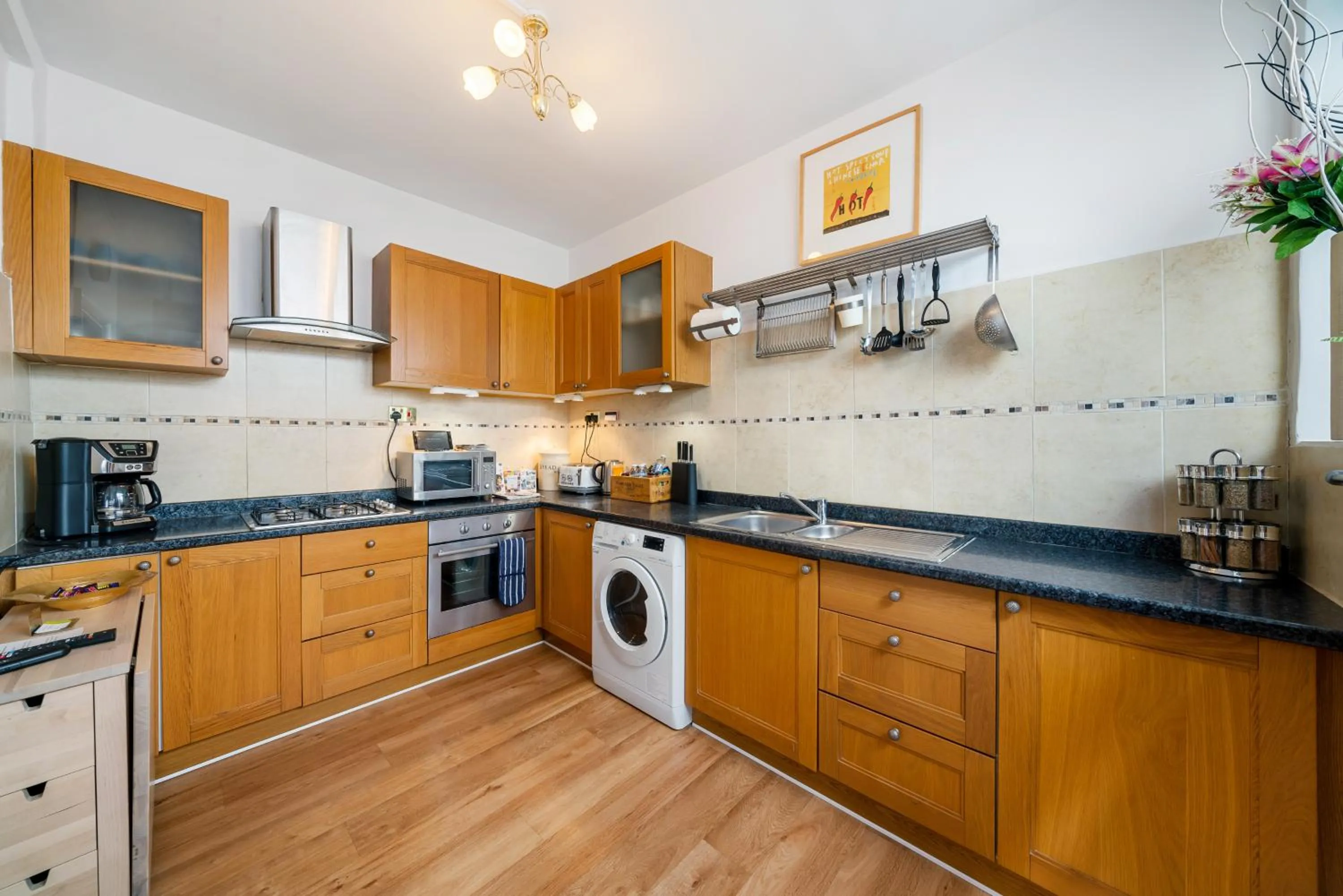 Kitchen or kitchenette in Lovely garden apartment in Wimbledon Town Centre with private parking by Wimbledon Holiday Lets