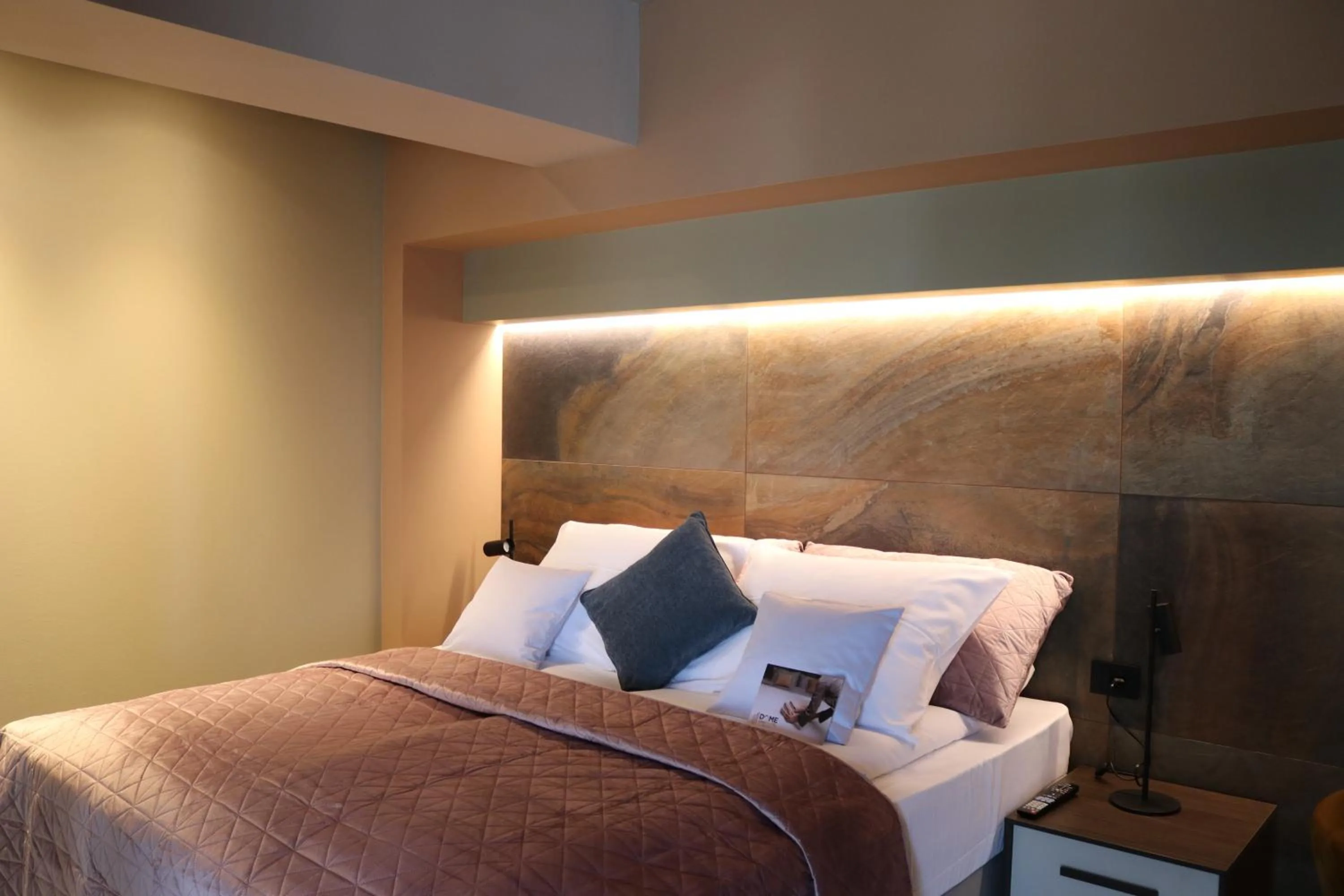 Bed in The Dome Aparthotel