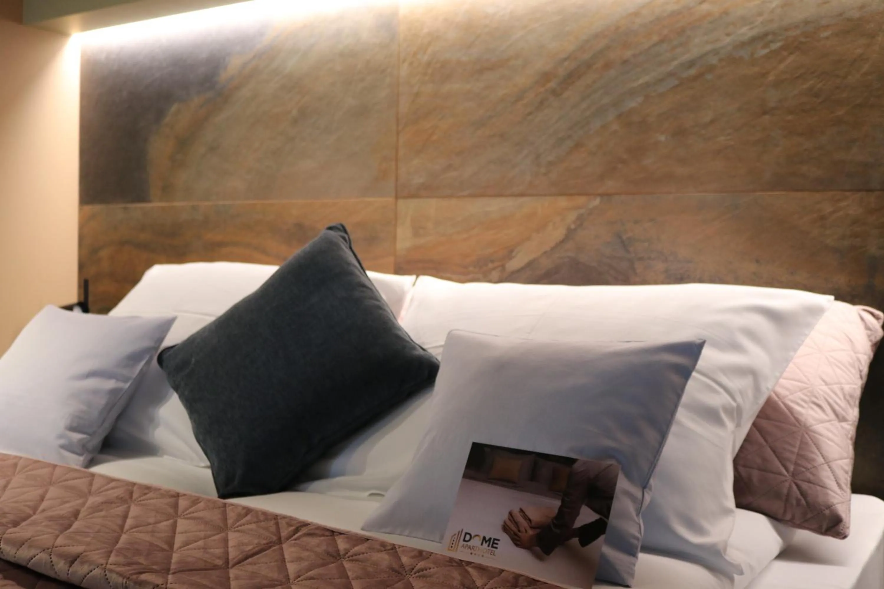 Bed in The Dome Aparthotel