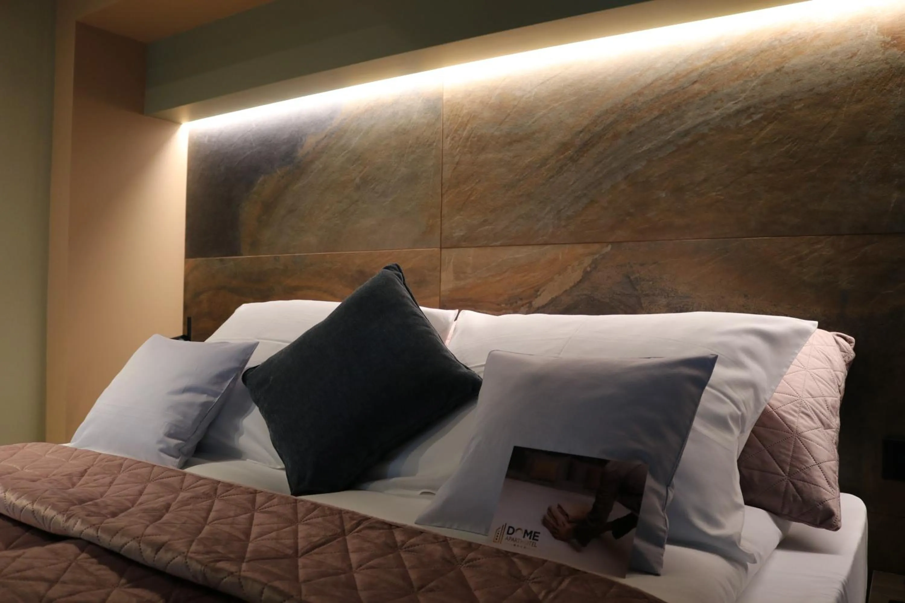 Bed in The Dome Aparthotel