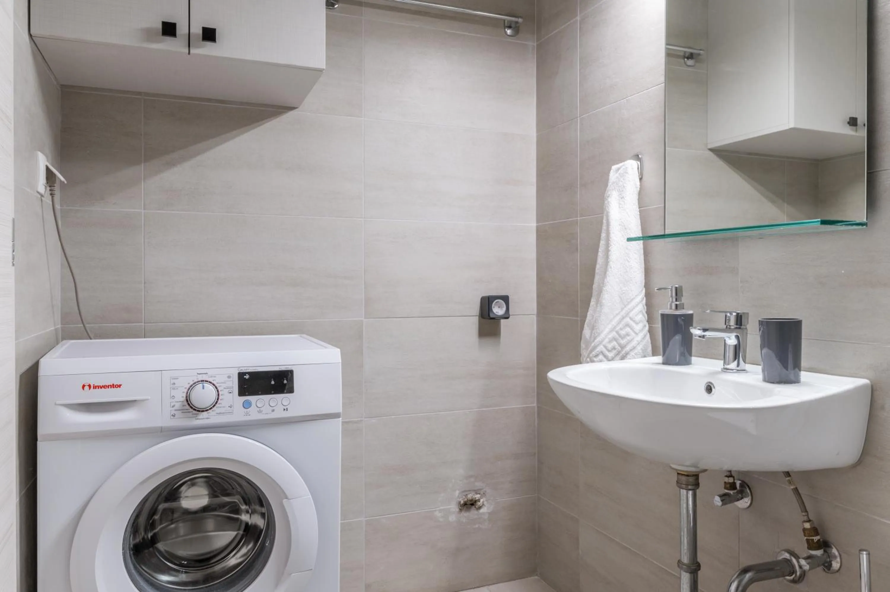 washing machine in Elvita Apartments 4