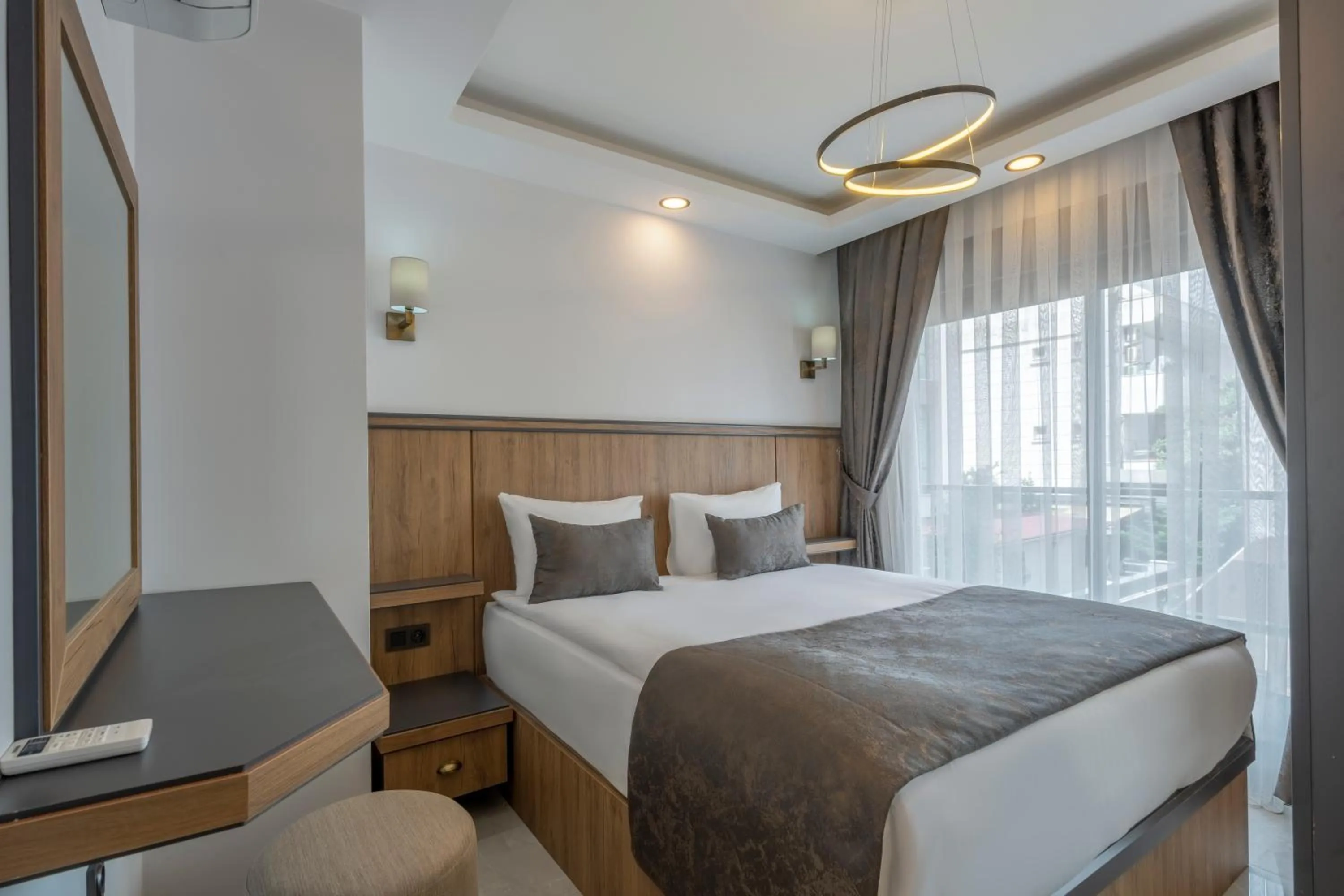 Bed in Quality Gold Suite Hotel