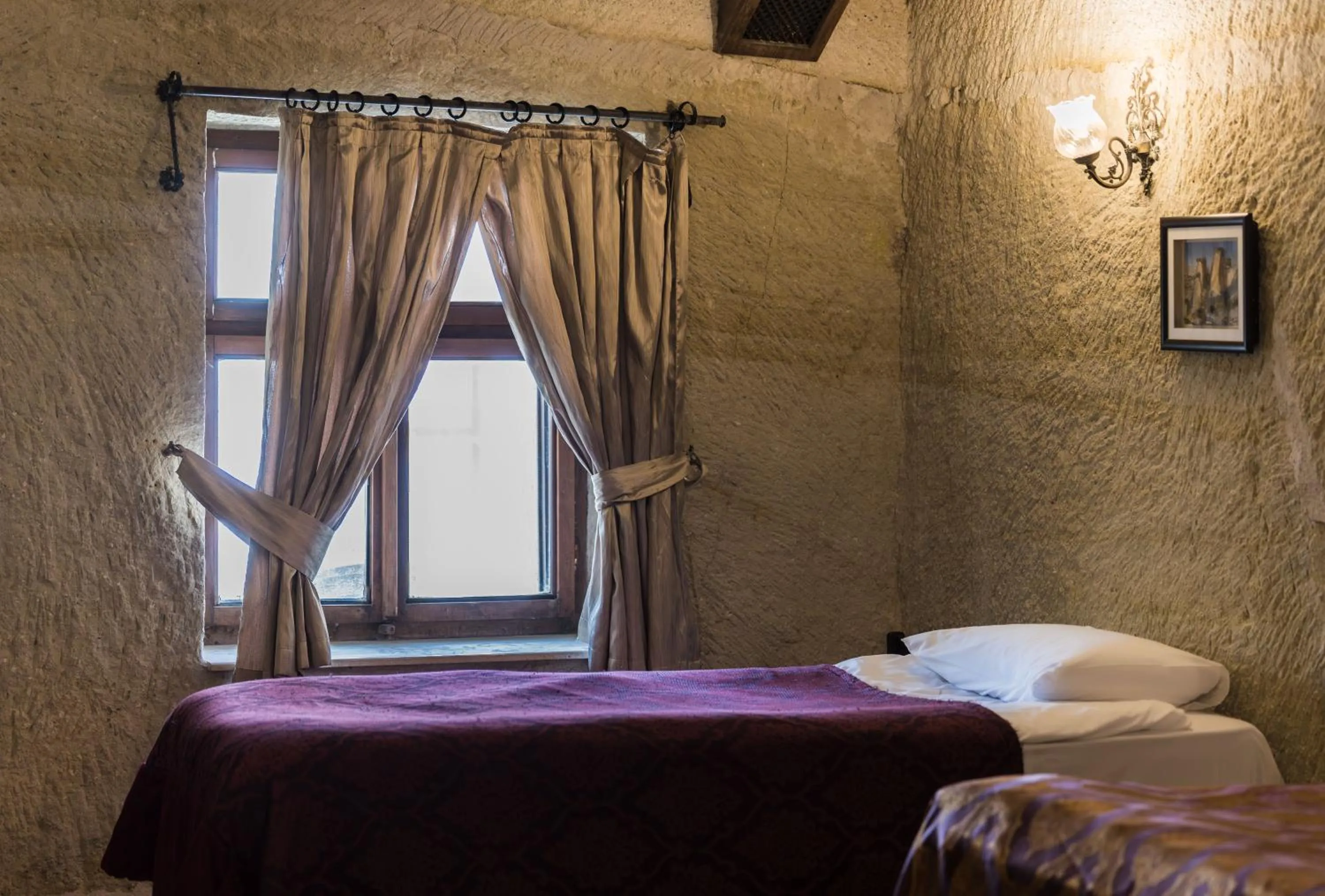 Bed in Phocas Cave Suites