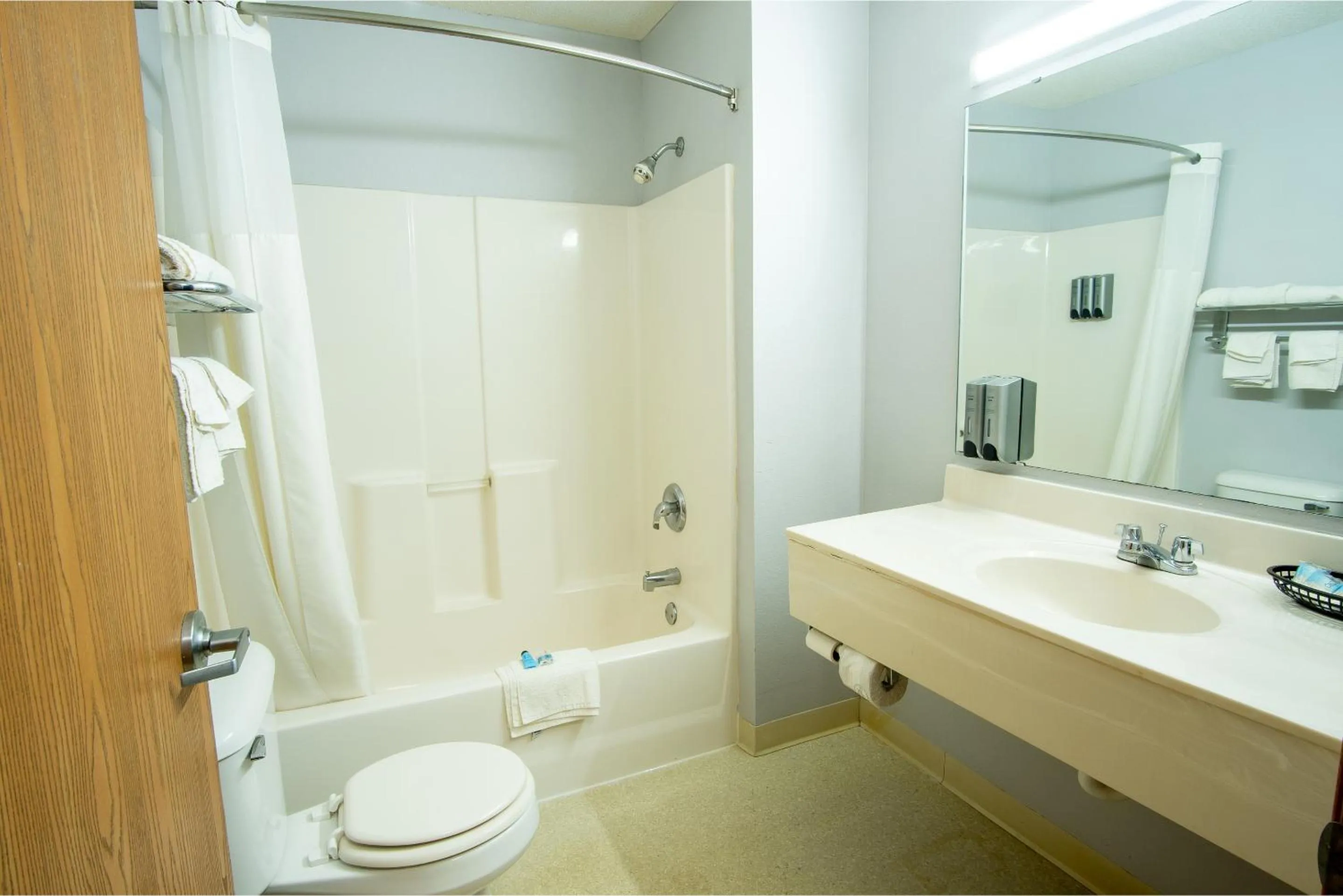 Toilet in Coratel Inn & Suites by Jasper New Richmond