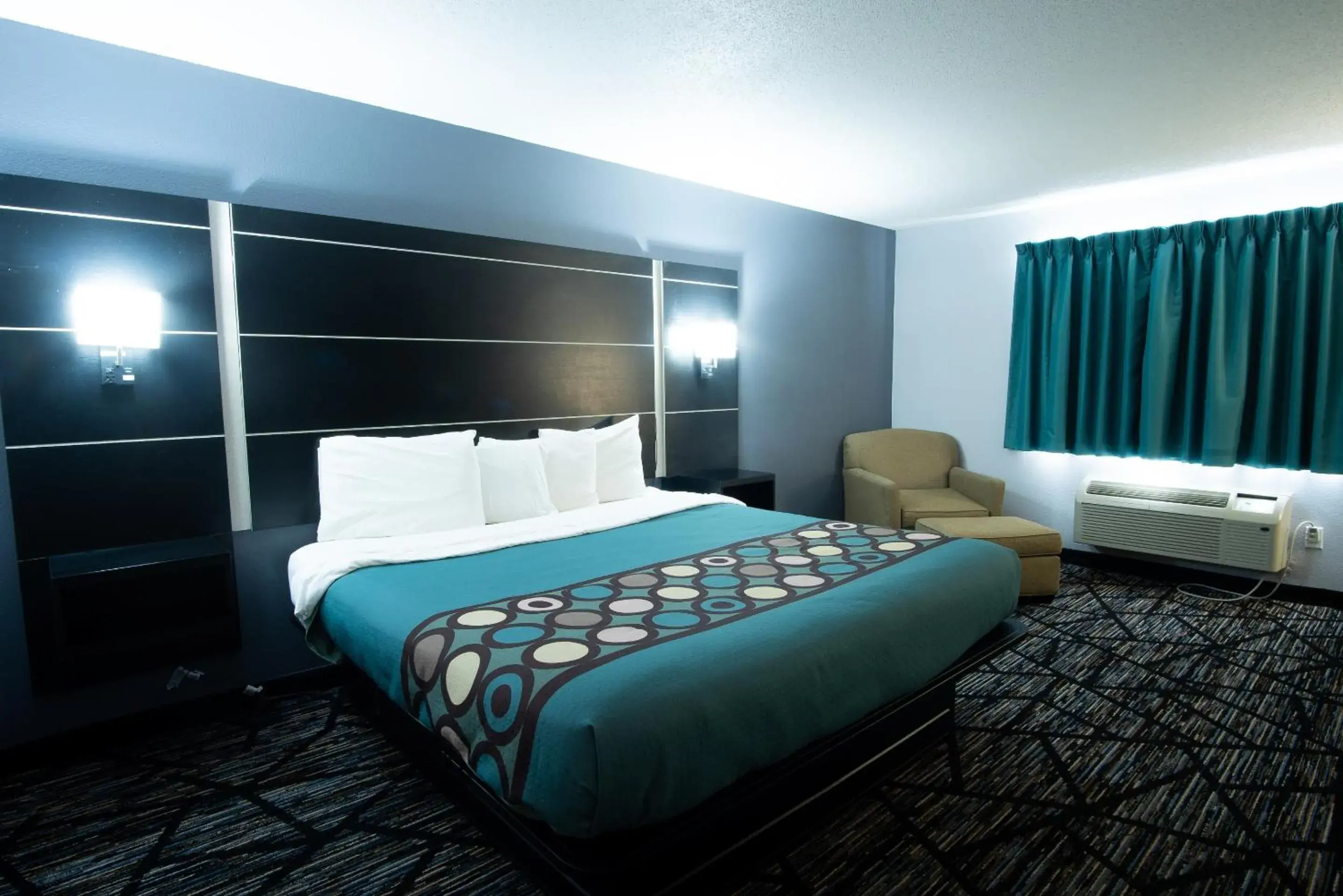 Bedroom, Bed in Coratel Inn & Suites by Jasper New Richmond Bedroom, Bed in Coratel Inn & Suites by Jasper New Richmond