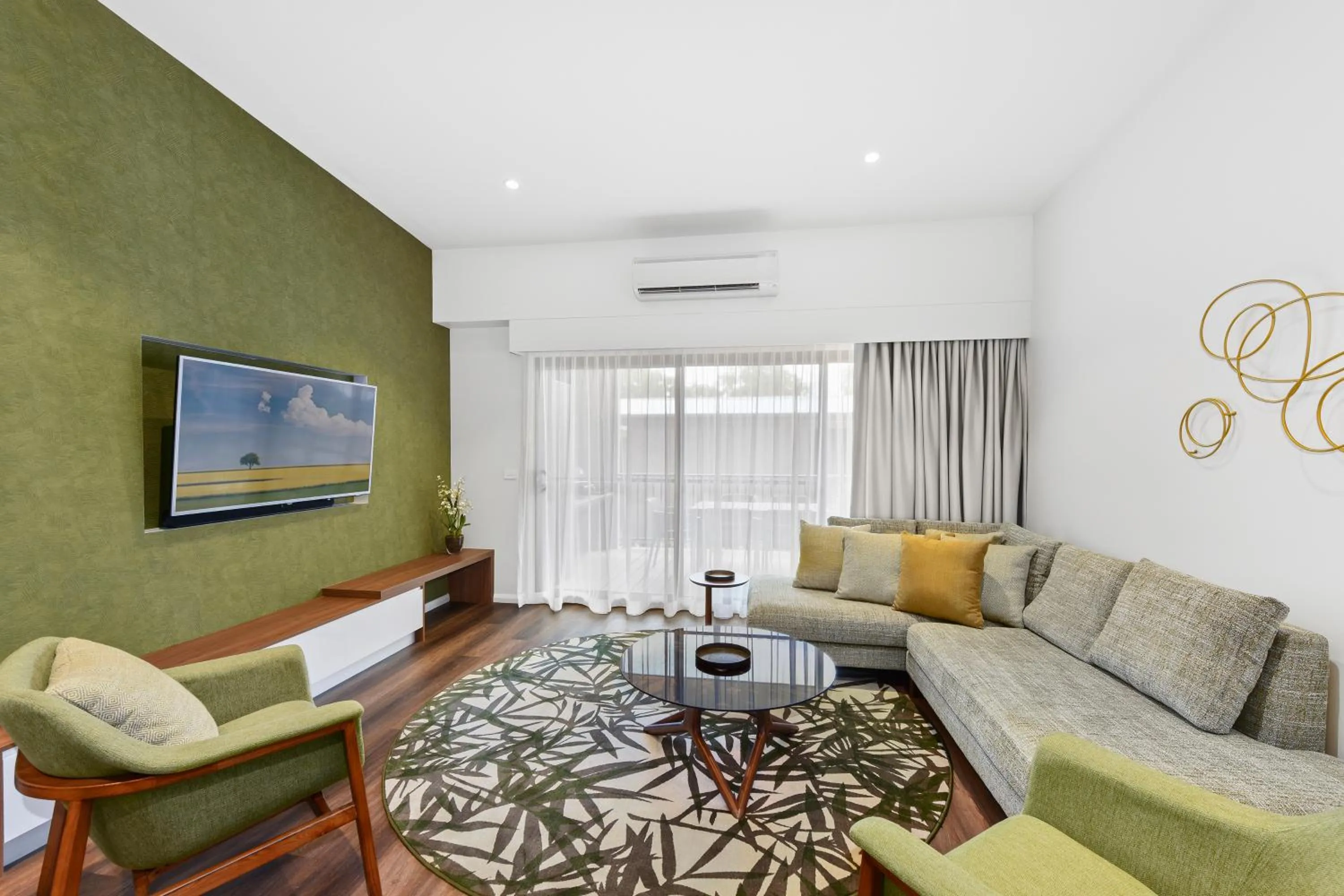 Living room in Club Wyndham Flynns Beach, Trademark Collection by Wyndham