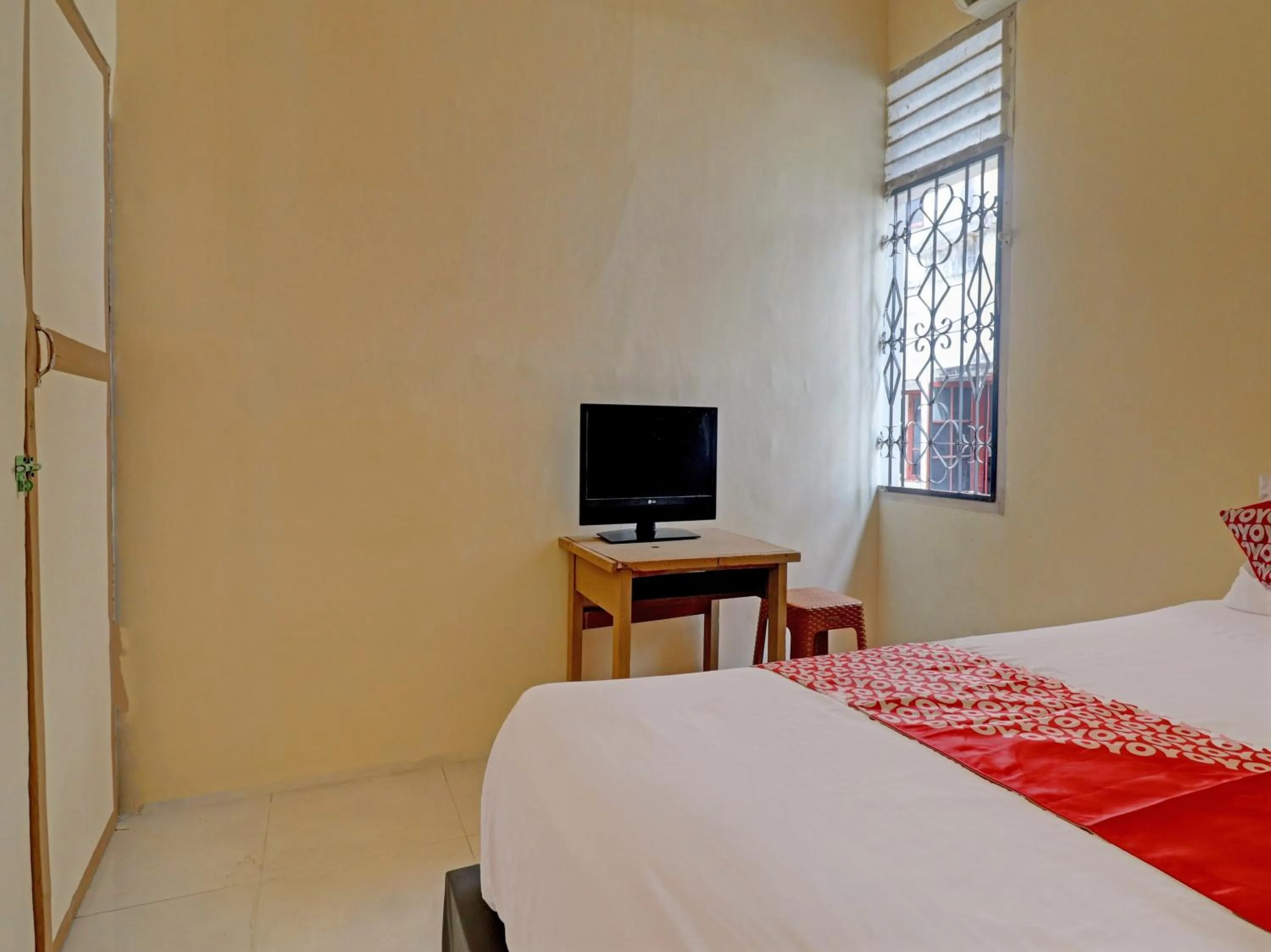 Bedroom, Bed in Hotel O Excellent Kost