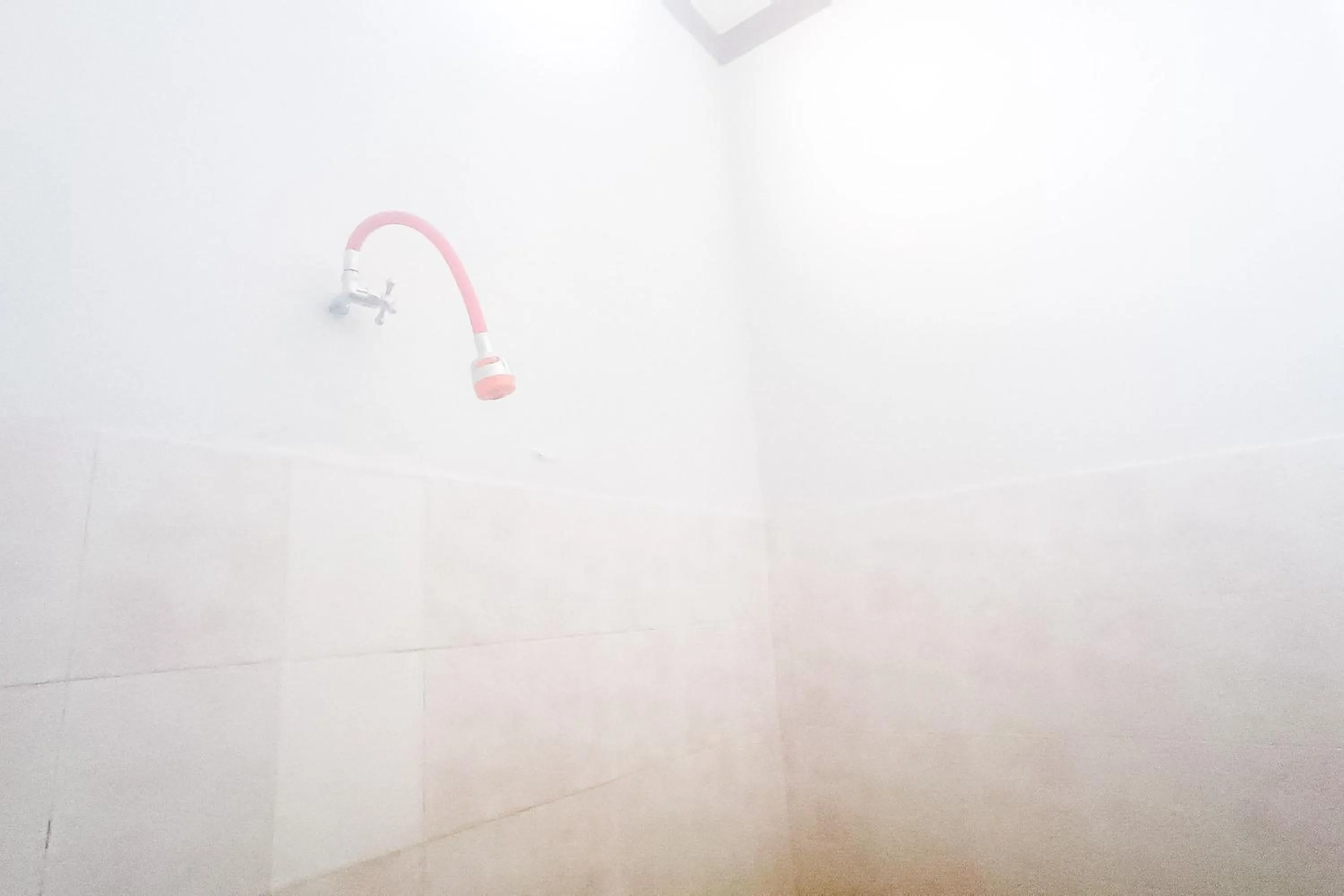 Bathroom in OYO 92560 Astri Homestay