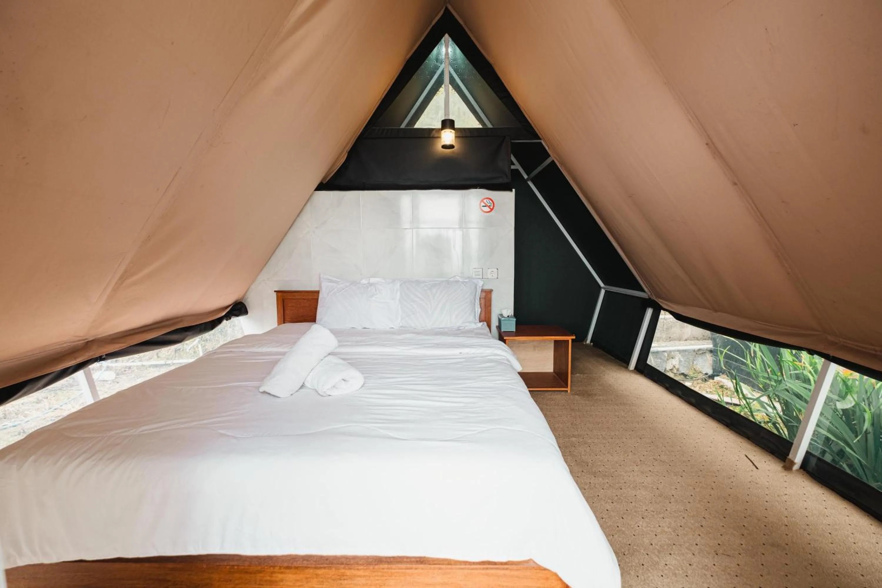 Bed in Popitan Garden Campground & Glamping Bedugul